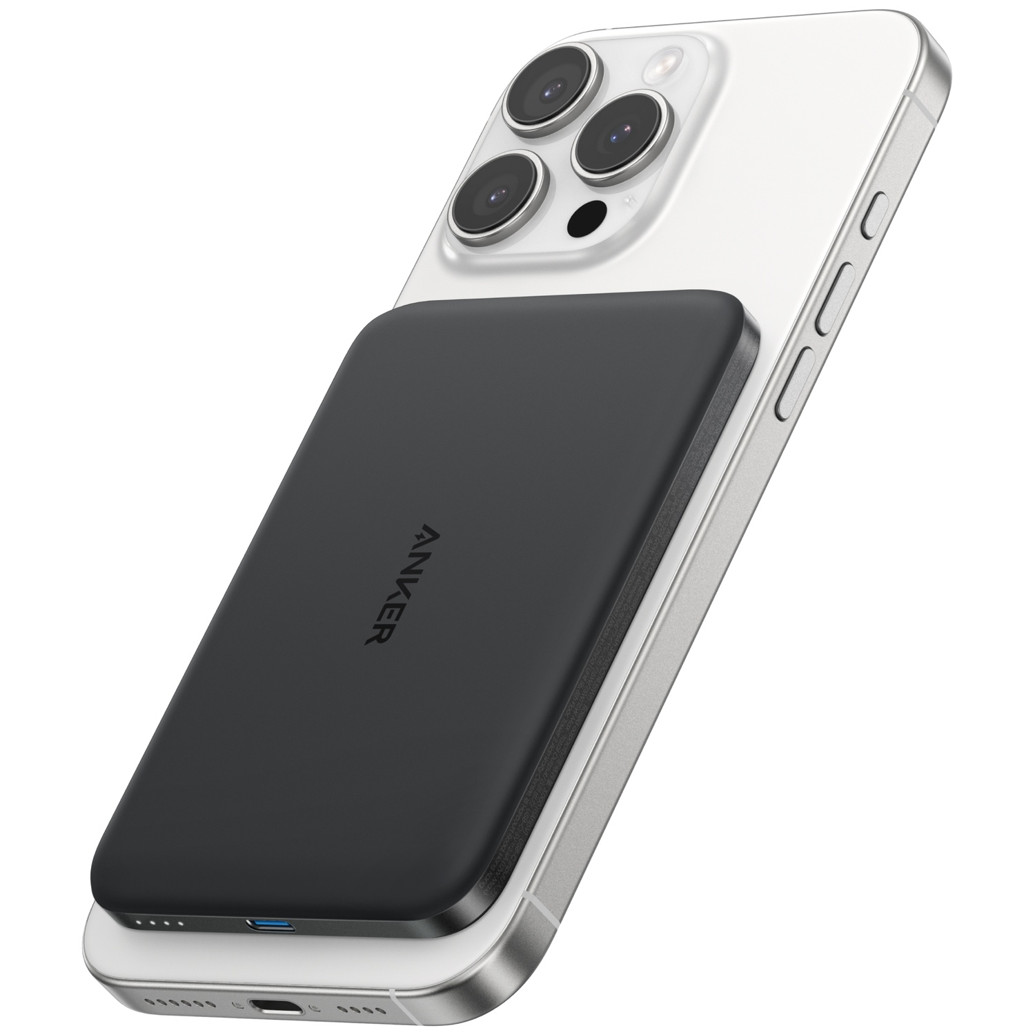 Een zwarte Anker lader is bevestigd aan de achterkant van een witte iPhone.