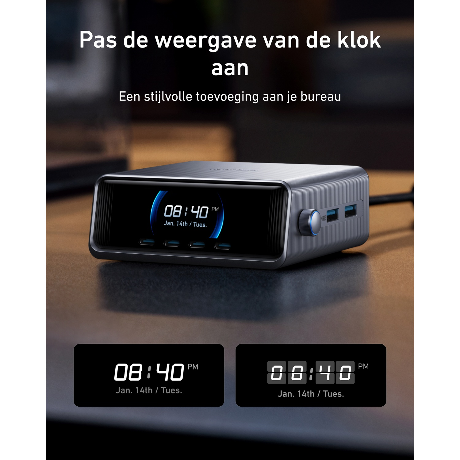 Gray digital alarm clock on a desk, showing time and date.