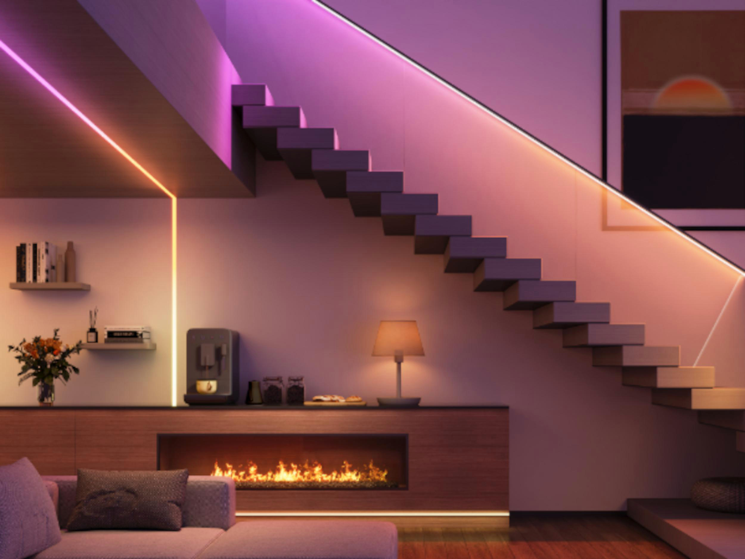 Modernes Wohnzimmer mit schwebender Treppe, Kamin und LED-Beleuchtung.