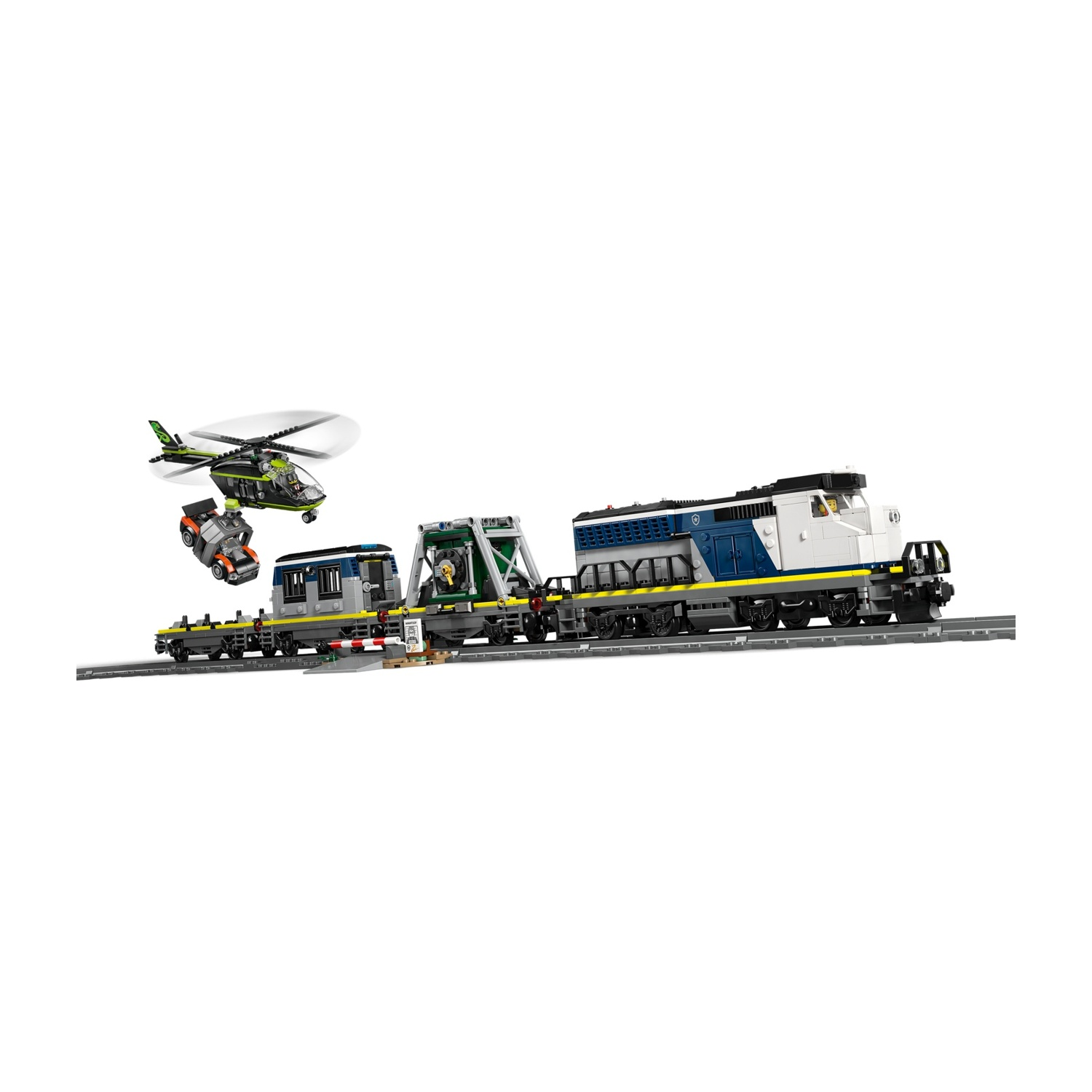 Un trenino giocattolo con locomotiva, vagoni, elicottero e auto sui binari.