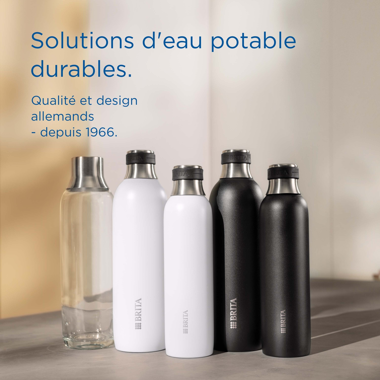 Five Brita bottles: one glass, two white, and two black.