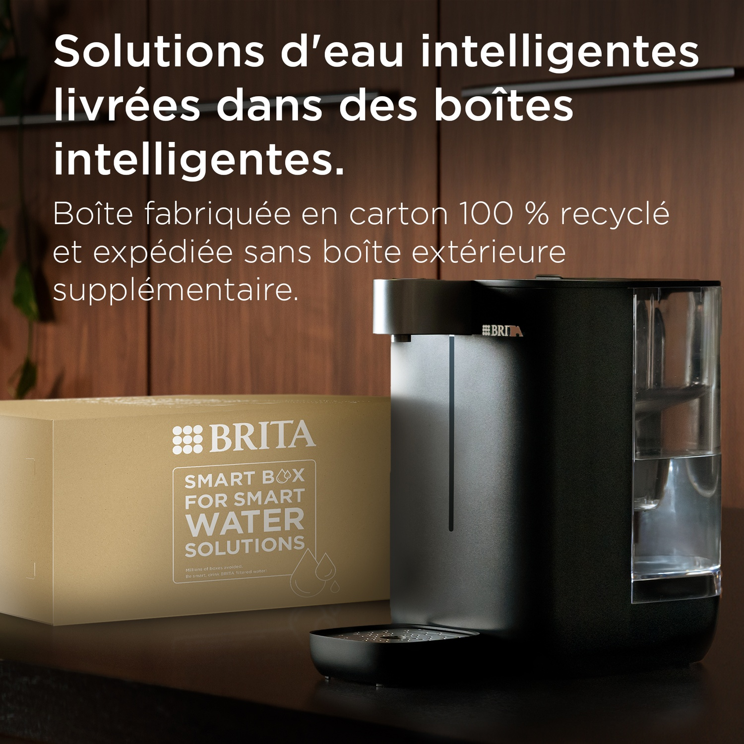 Brita water dispenser next to a recycled cardboard box with Brita logo.