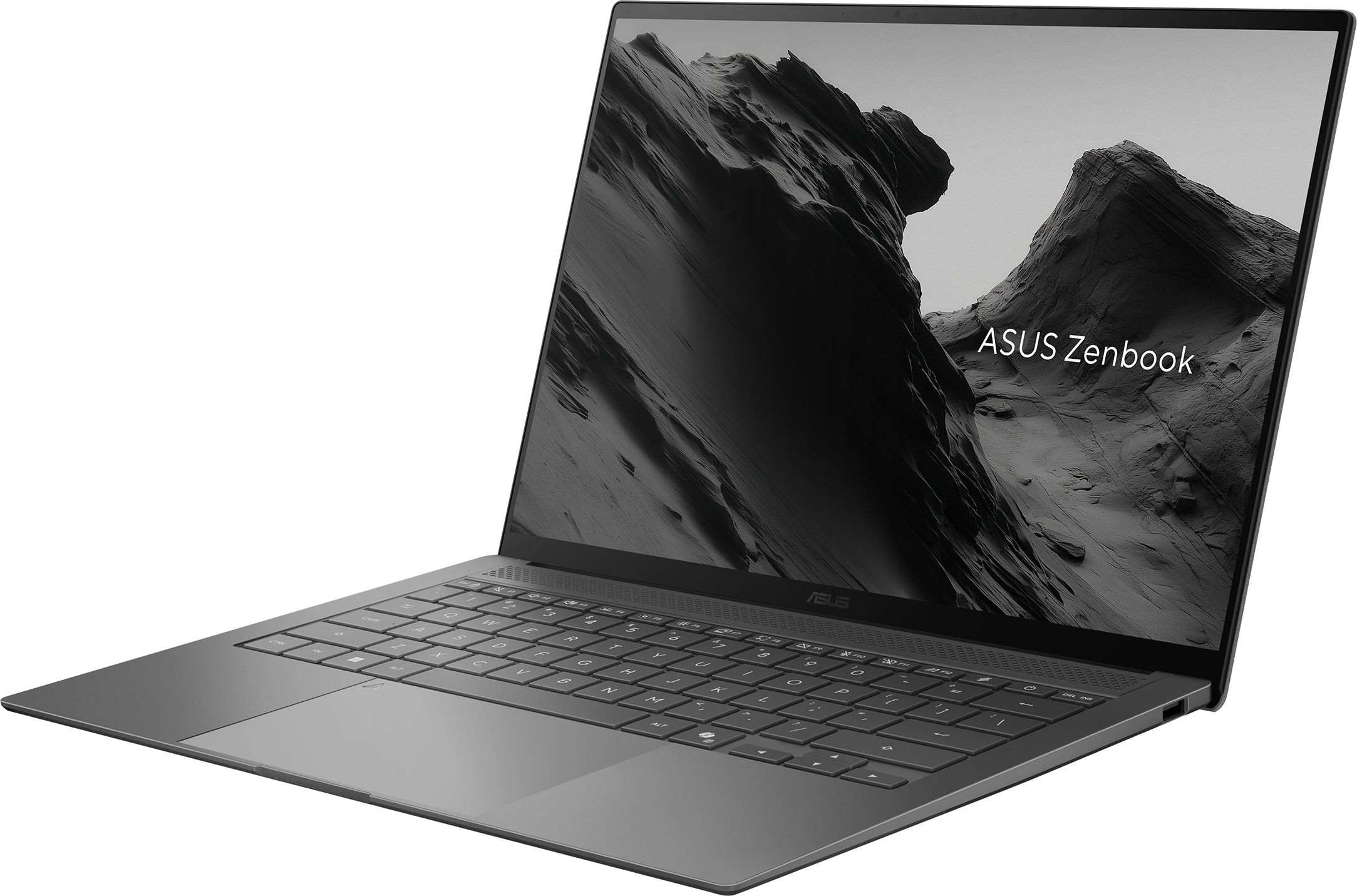 Un ordinateur portable ASUS Zenbook gris avec clavier rétroéclairé et fond d'écran montagne.