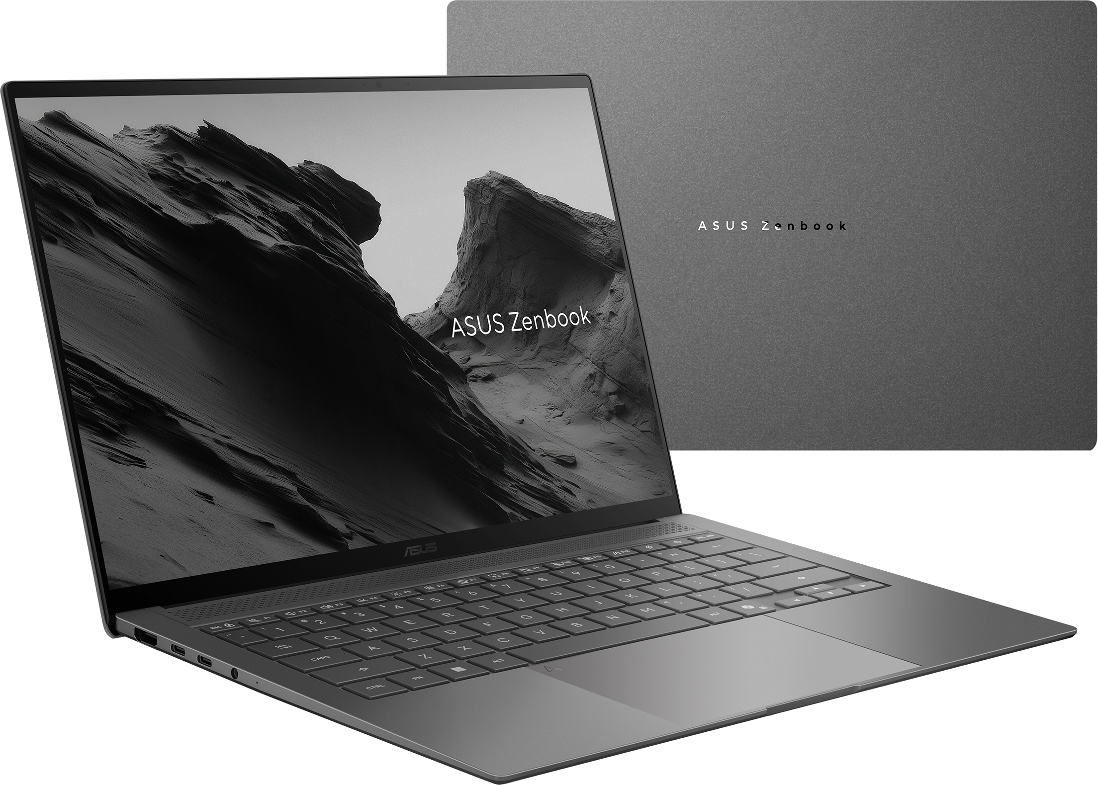 Un ordinateur portable Asus Zenbook gris est ouvert, affichant un fond d'écran de paysage montagneux.