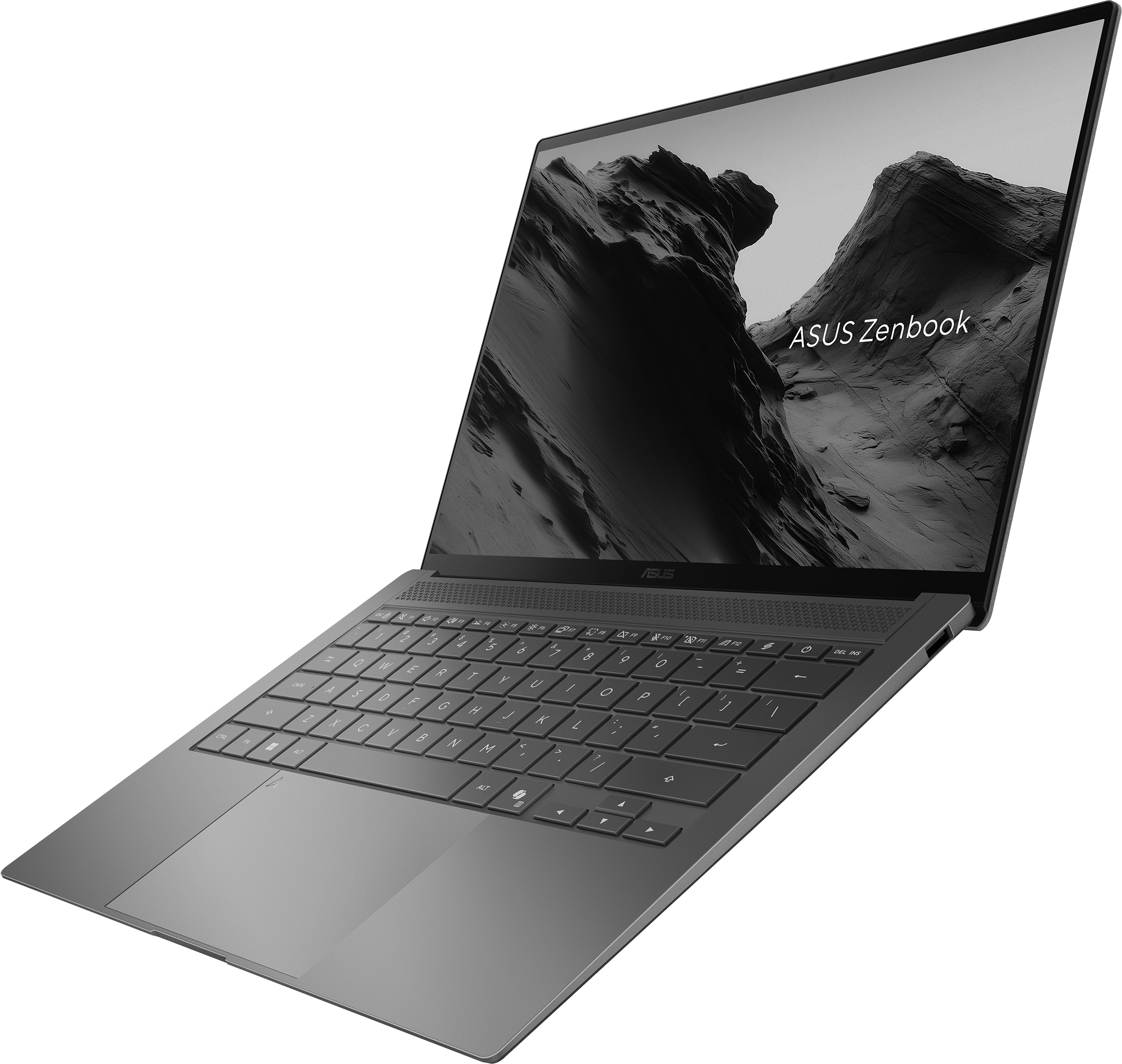Un ordinateur portable ASUS Zenbook sombre et ouvert avec un fond d'écran de montagne.