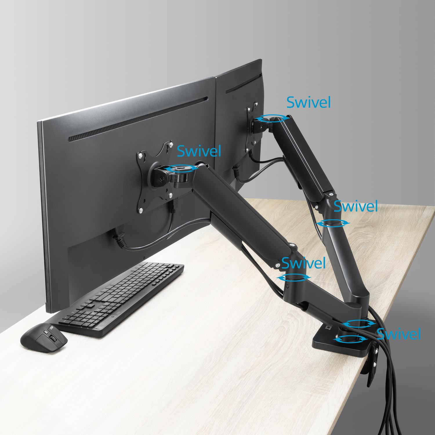 Black dual monitor mount on a desk with keyboard and mouse.