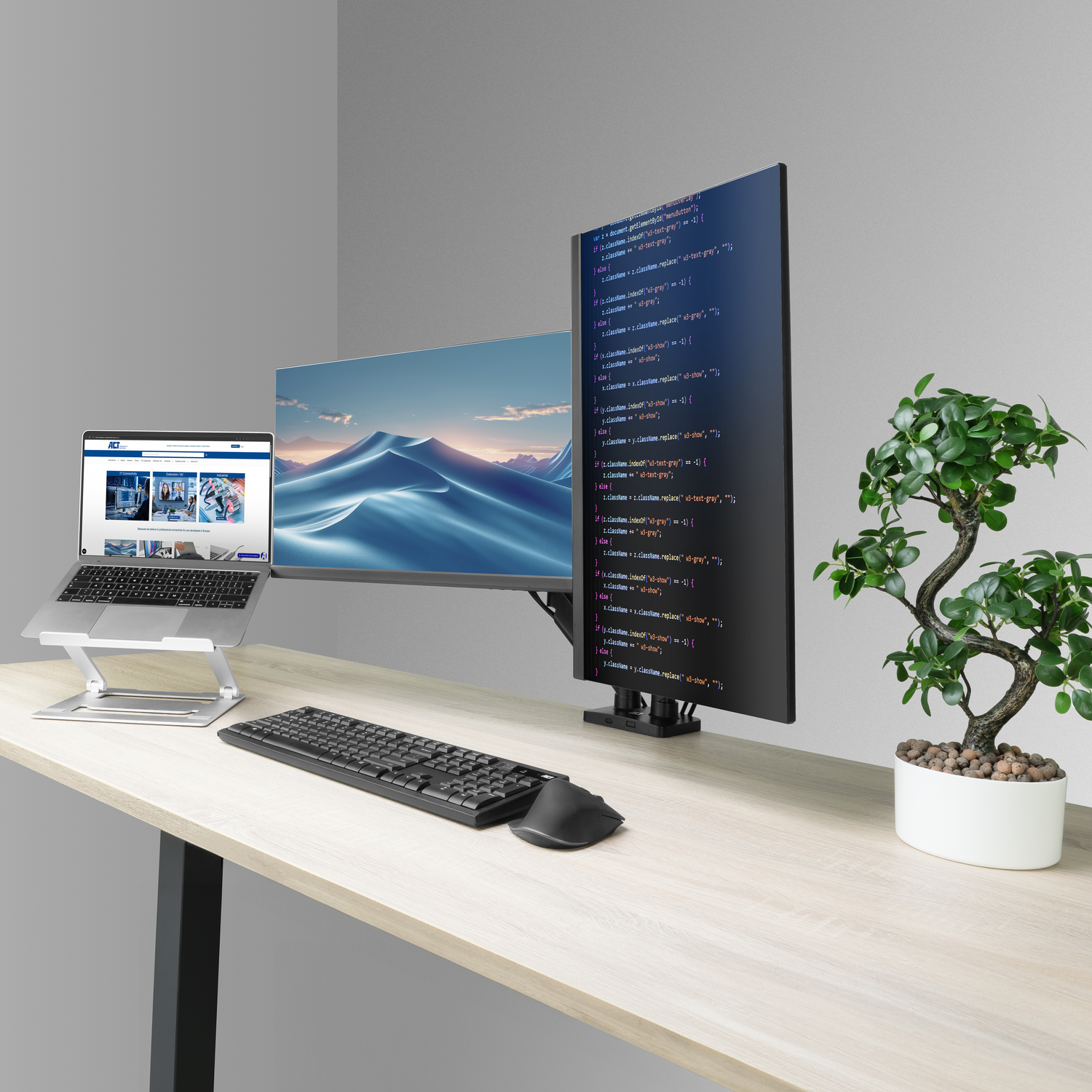 A laptop on a stand, keyboard, mouse, and two monitors on a desk.