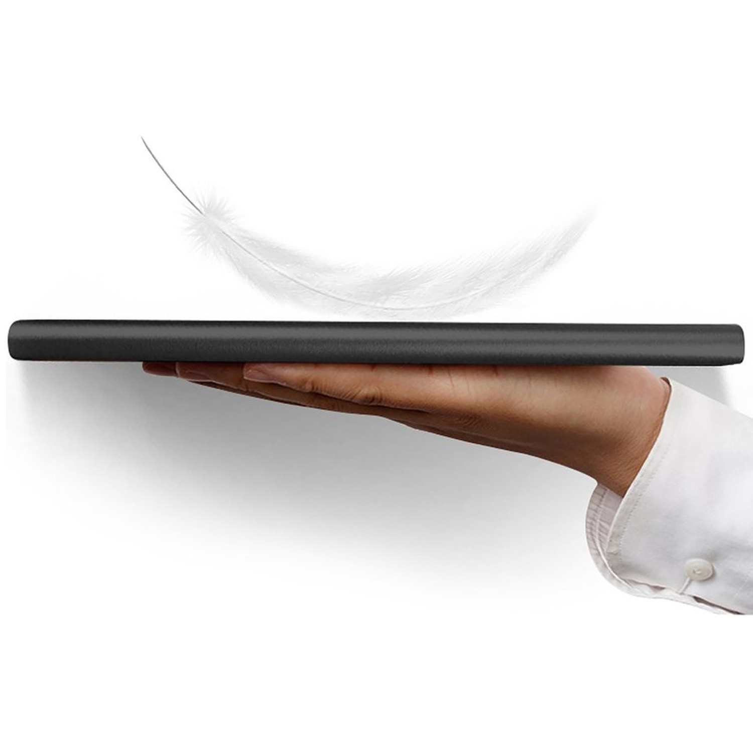 A hand in a white shirt holds a thin black object, a feather floats above it.