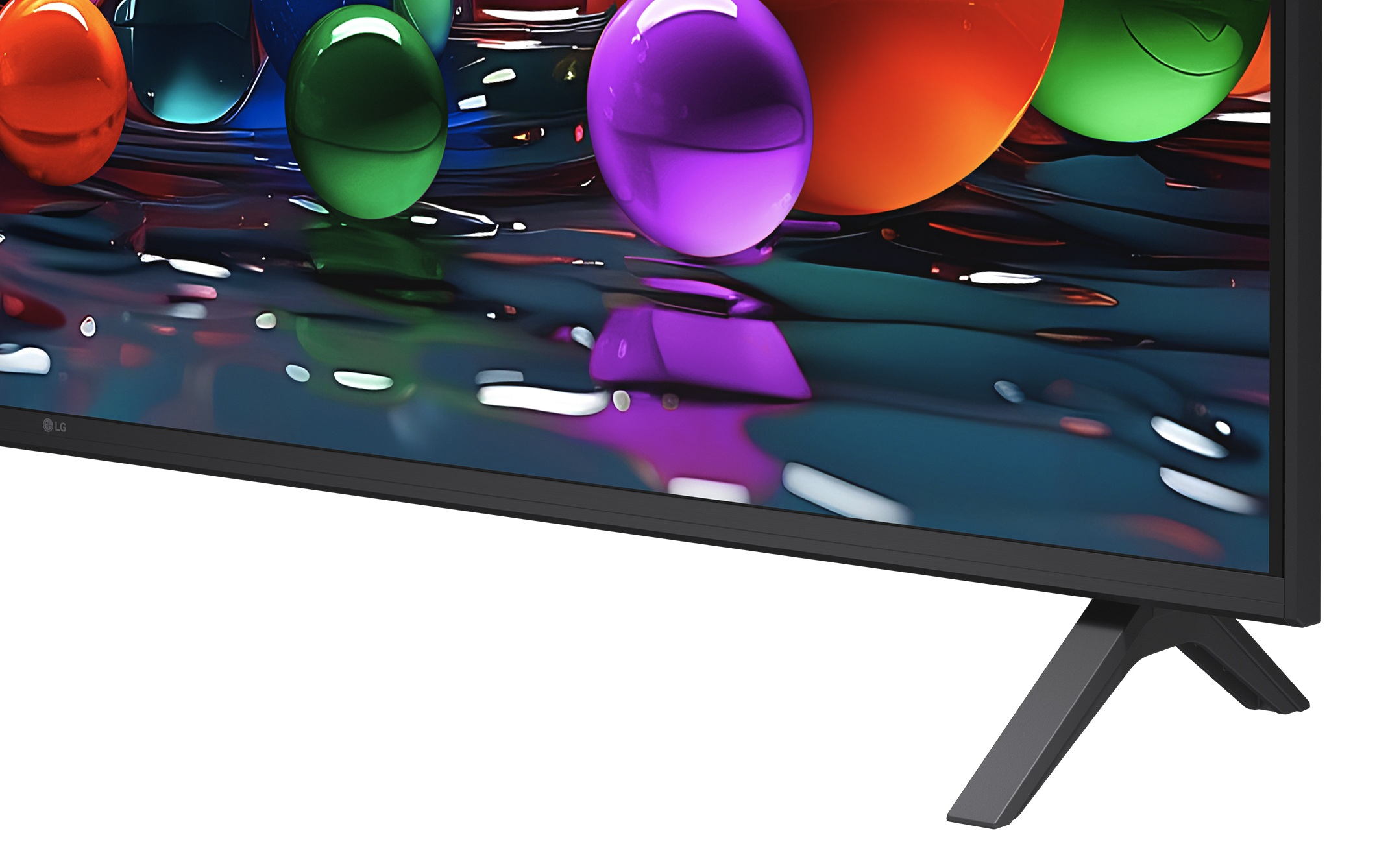 Ekran telewizora wyświetla kolorowe kule na ciemnej, błyszczącej powierzchni.