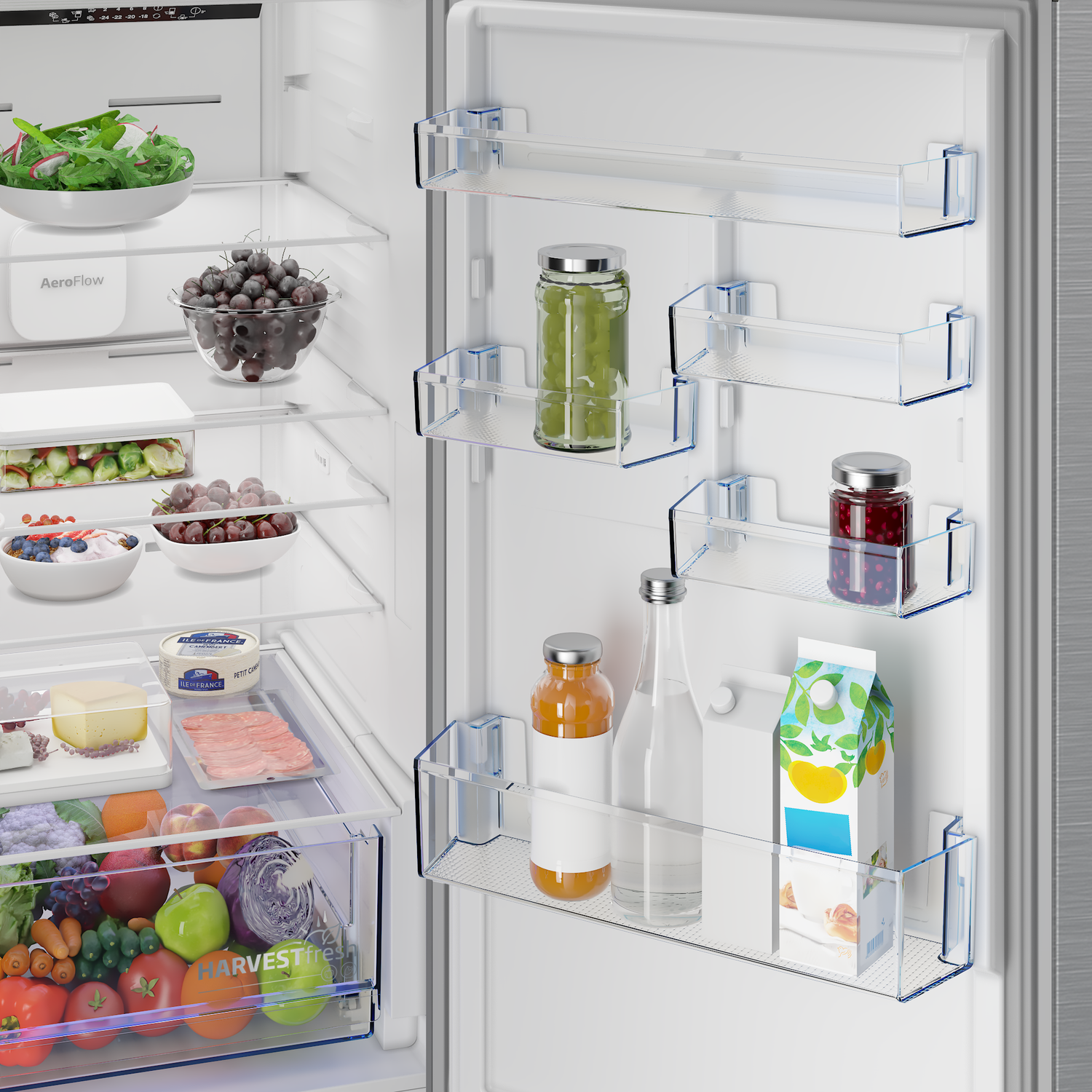 Open refrigerator with fruits, vegetables, juice, and jam on shelves.