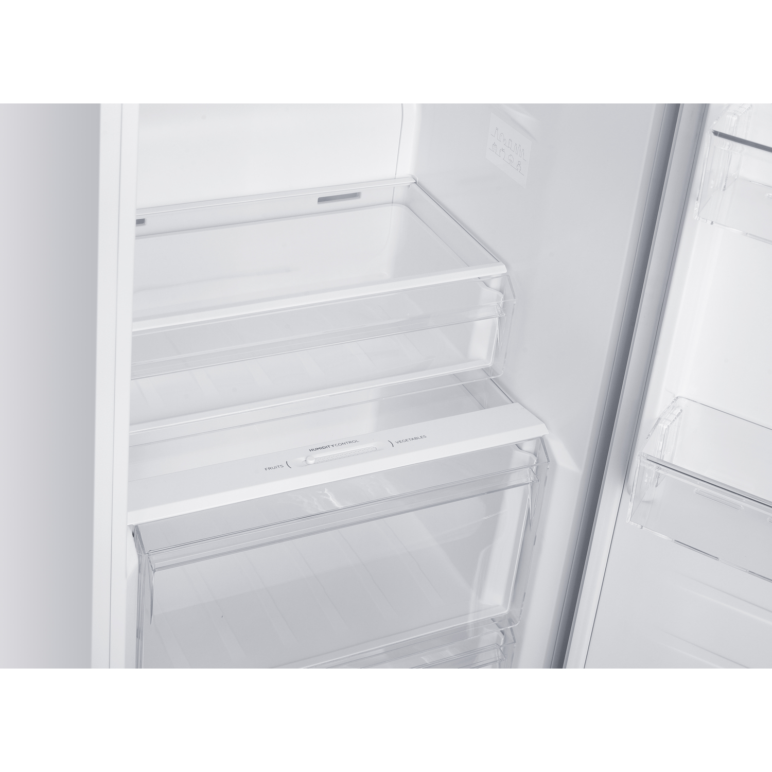 Empty refrigerator interior with two drawers and shelves.