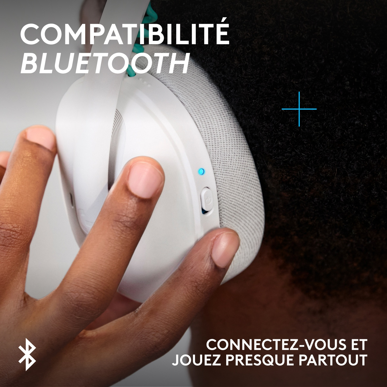 A person wearing headphones with a Bluetooth symbol.