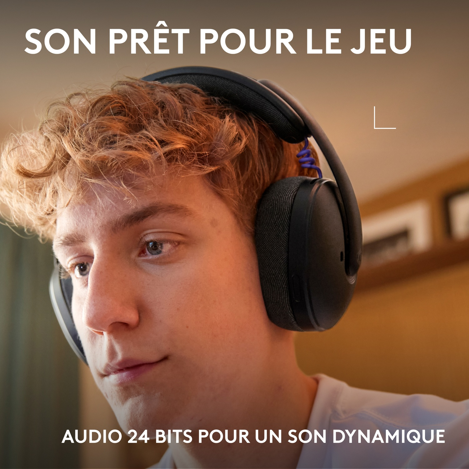 Young man with red hair wearing headphones. Text: "SON PRÊT POUR LE JEU" and "AUDIO 24 BITS POUR UN SON DYNAMIQUE".
