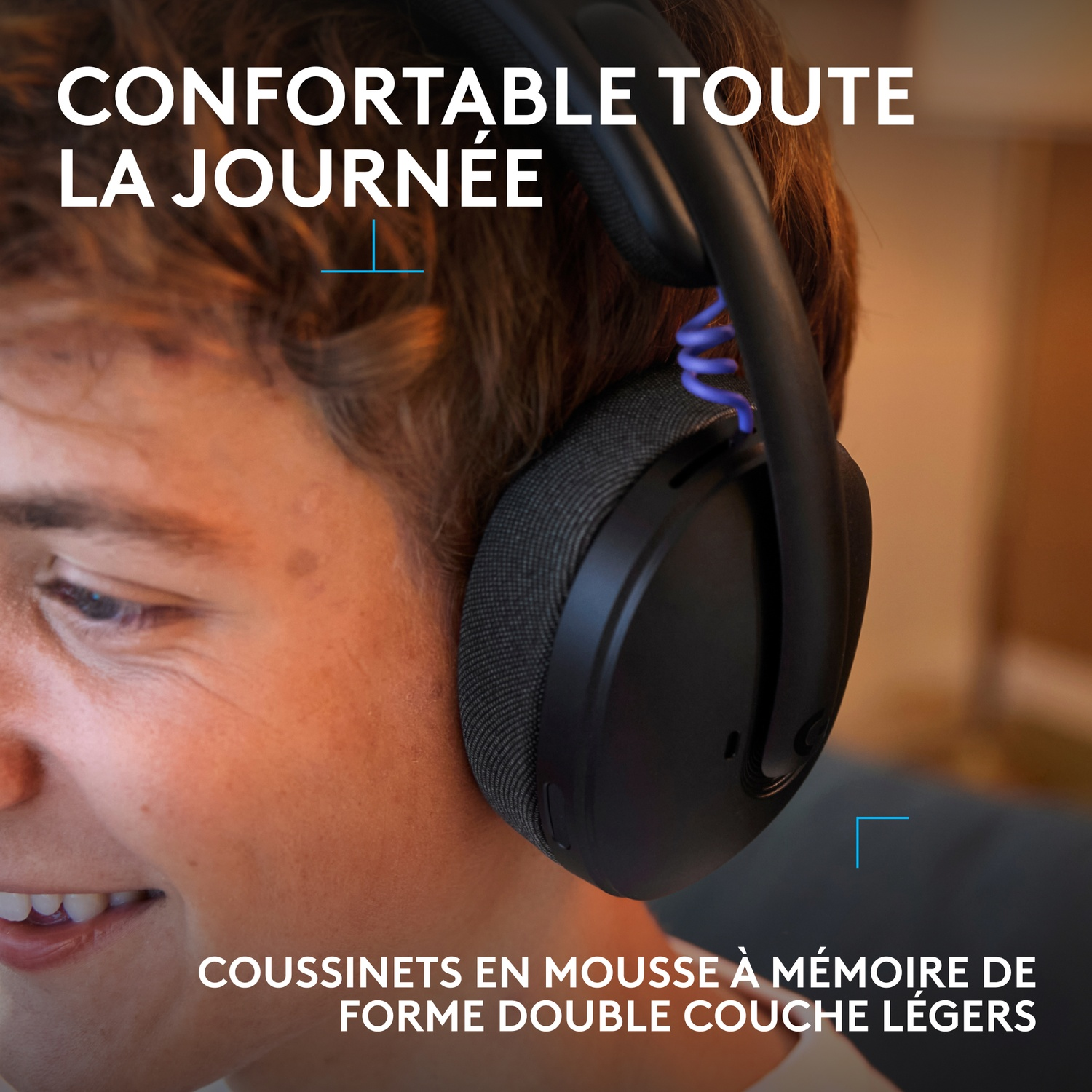 Young person wearing black headphones with blue cord, text: Comfortable all day.