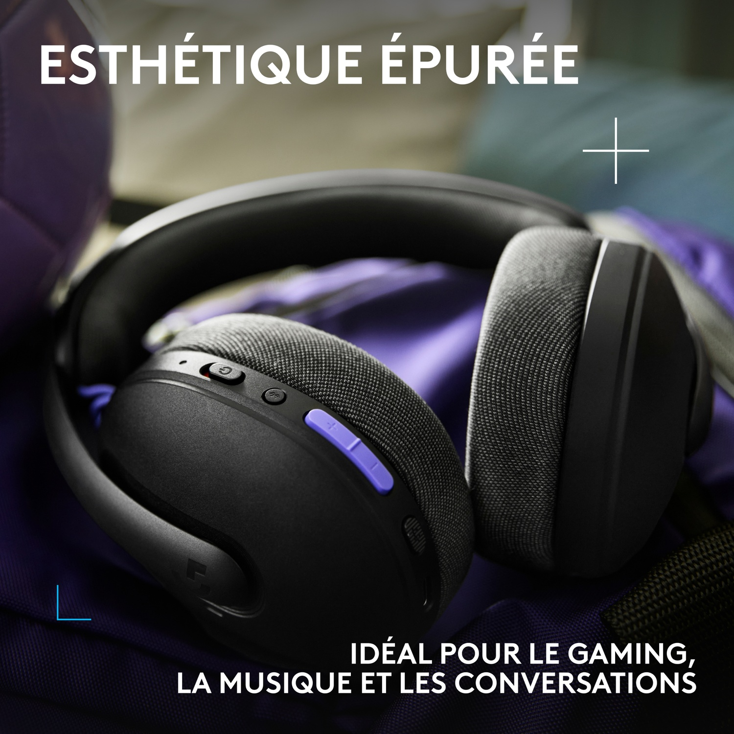 Black headphones with purple accents rest on a purple backpack.