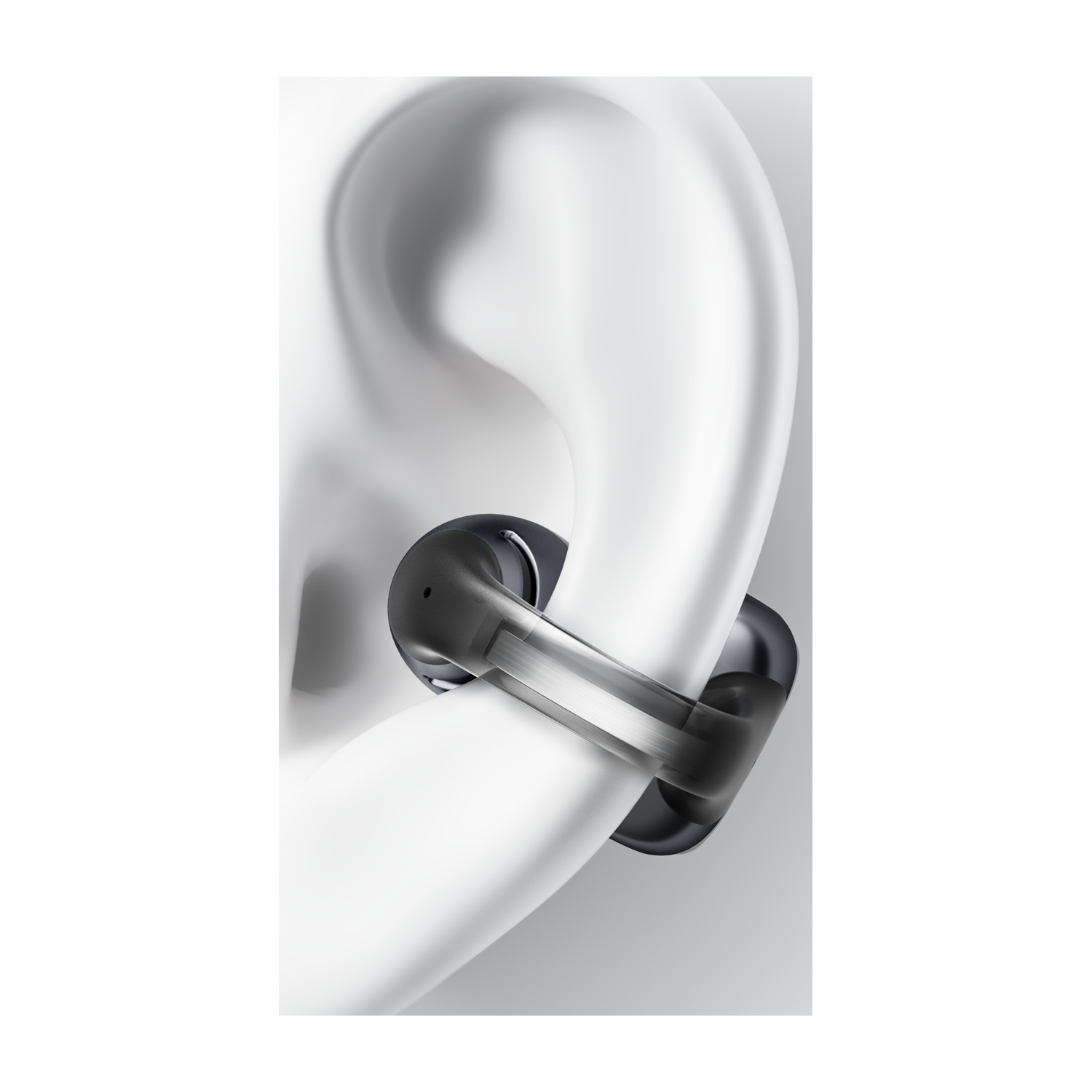 Un auricolare nero poggia in un orecchio bianco stilizzato.