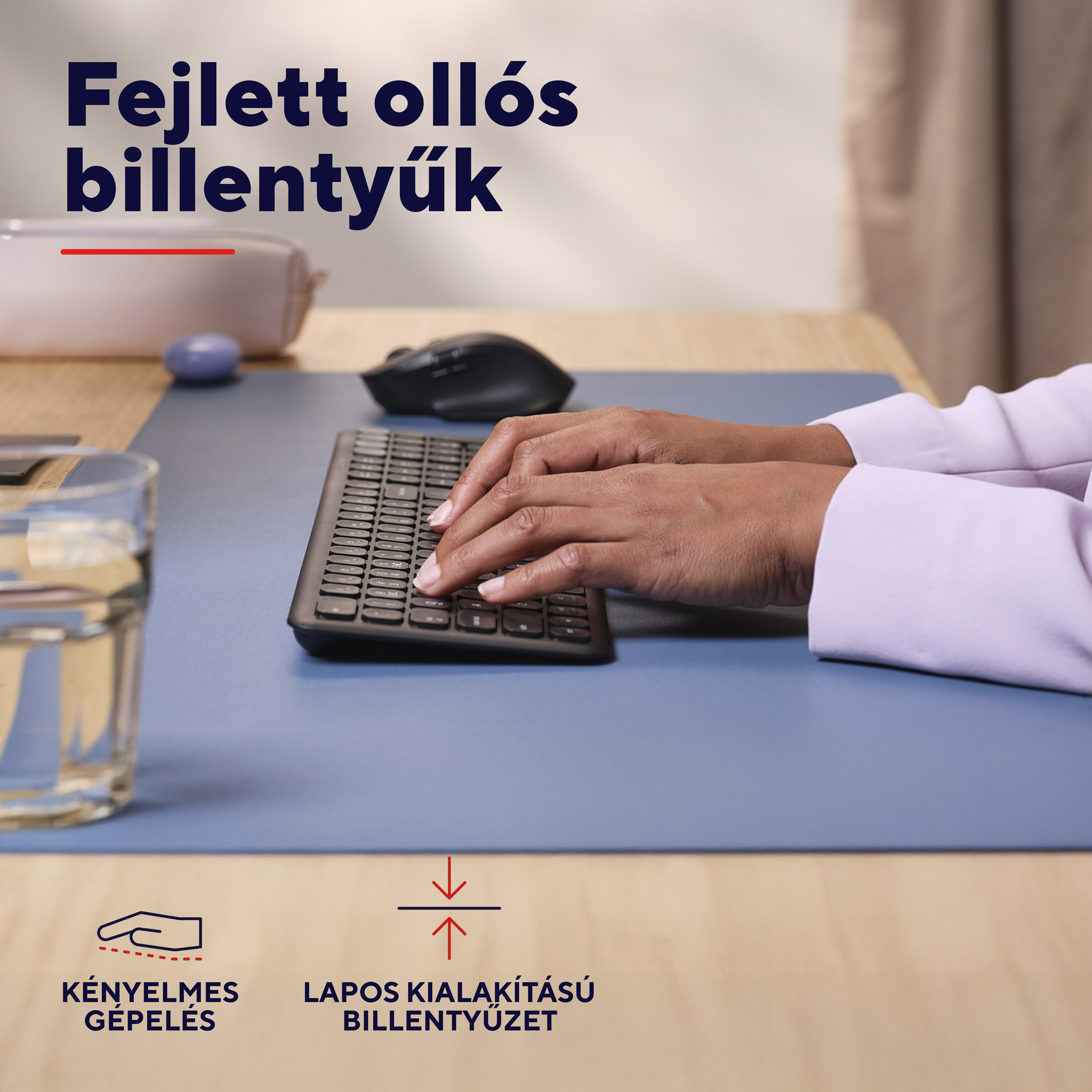 Keze gépel egy billentyűzeten, mellette egér és pohár víz.