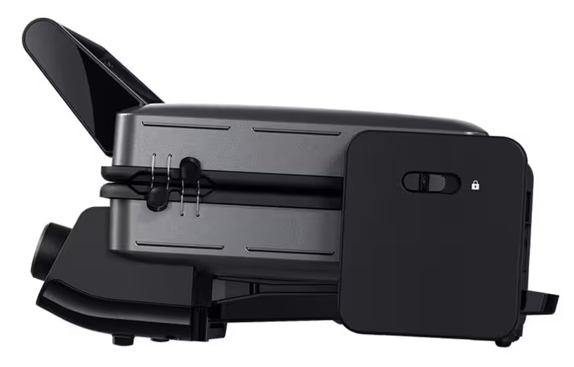 Czarny toster z otwartą pokrywą, pokazujący srebrne dźwignie.