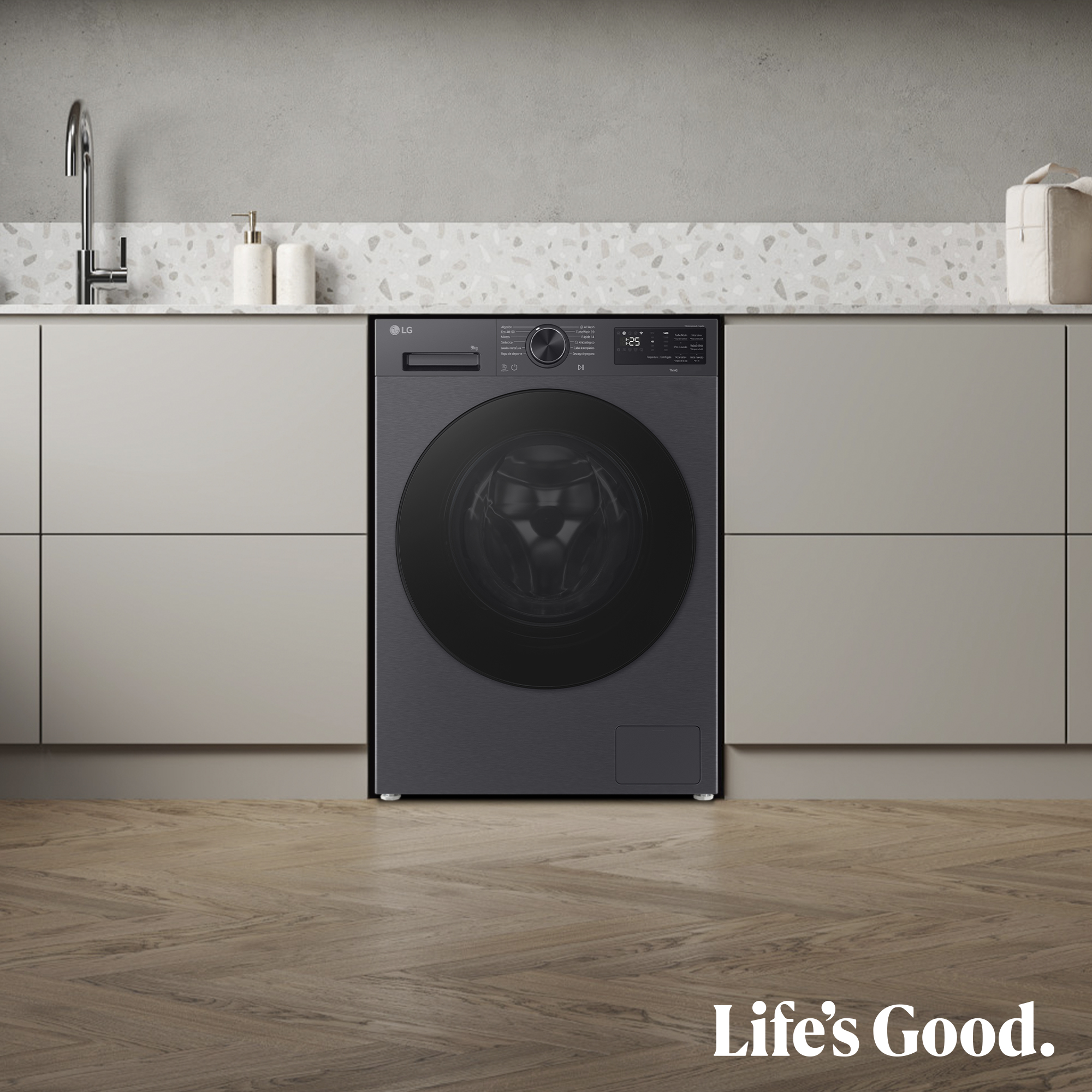 Una lavadora LG negra está centrada en una cocina moderna con gabinetes beige claro.