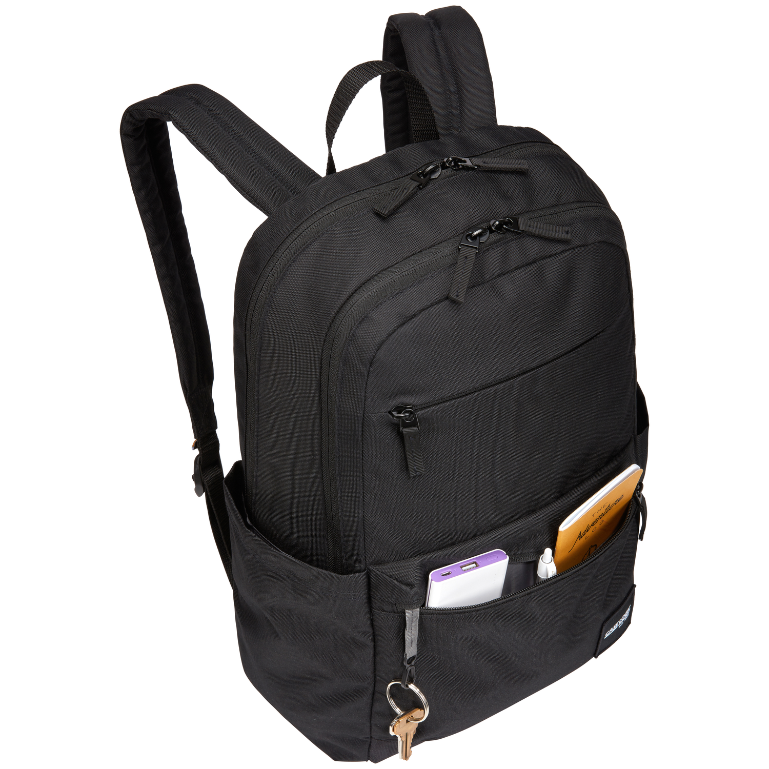 Sac à dos noir avec poche avant ouverte contenant téléphone, stylo et petit carnet.