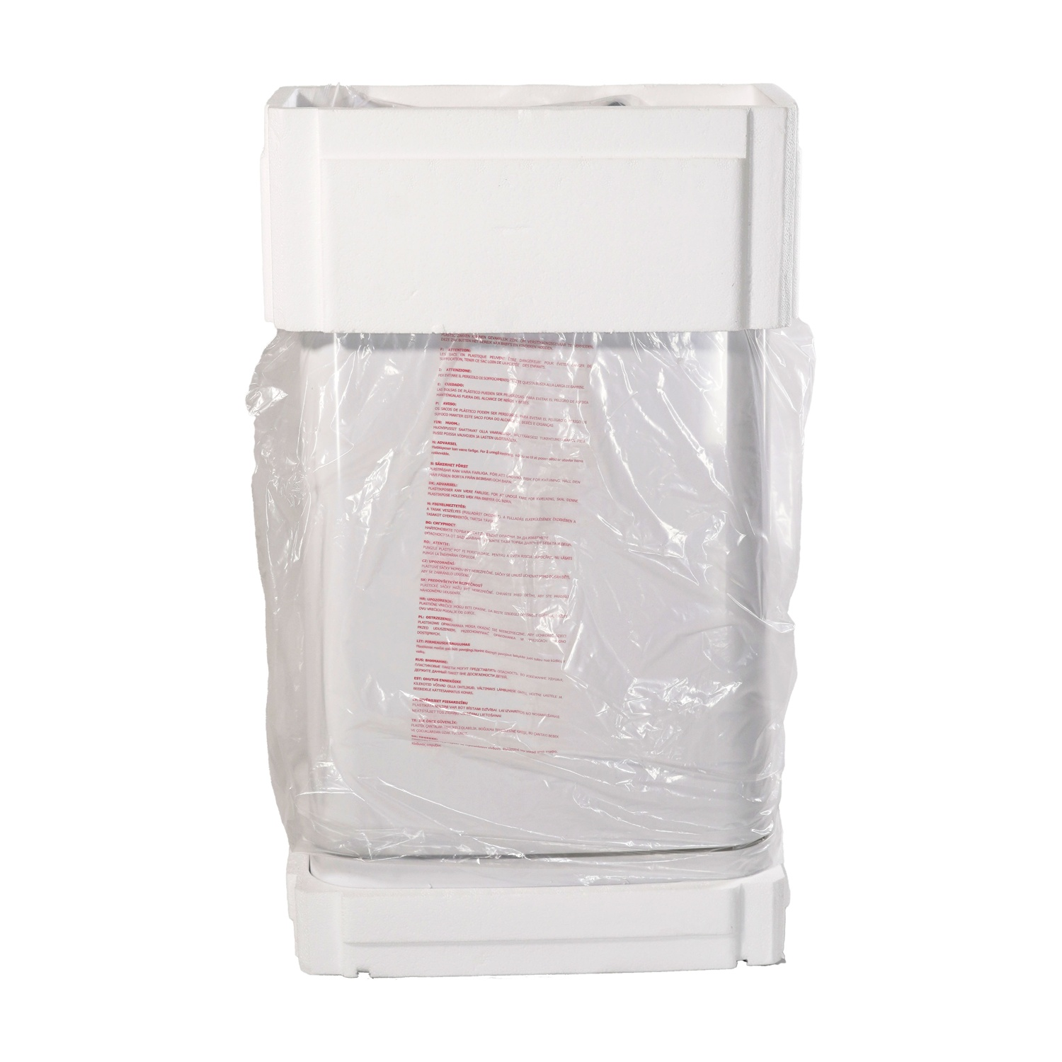 Un elettrodomestico bianco è avvolto in plastica e polistirolo.