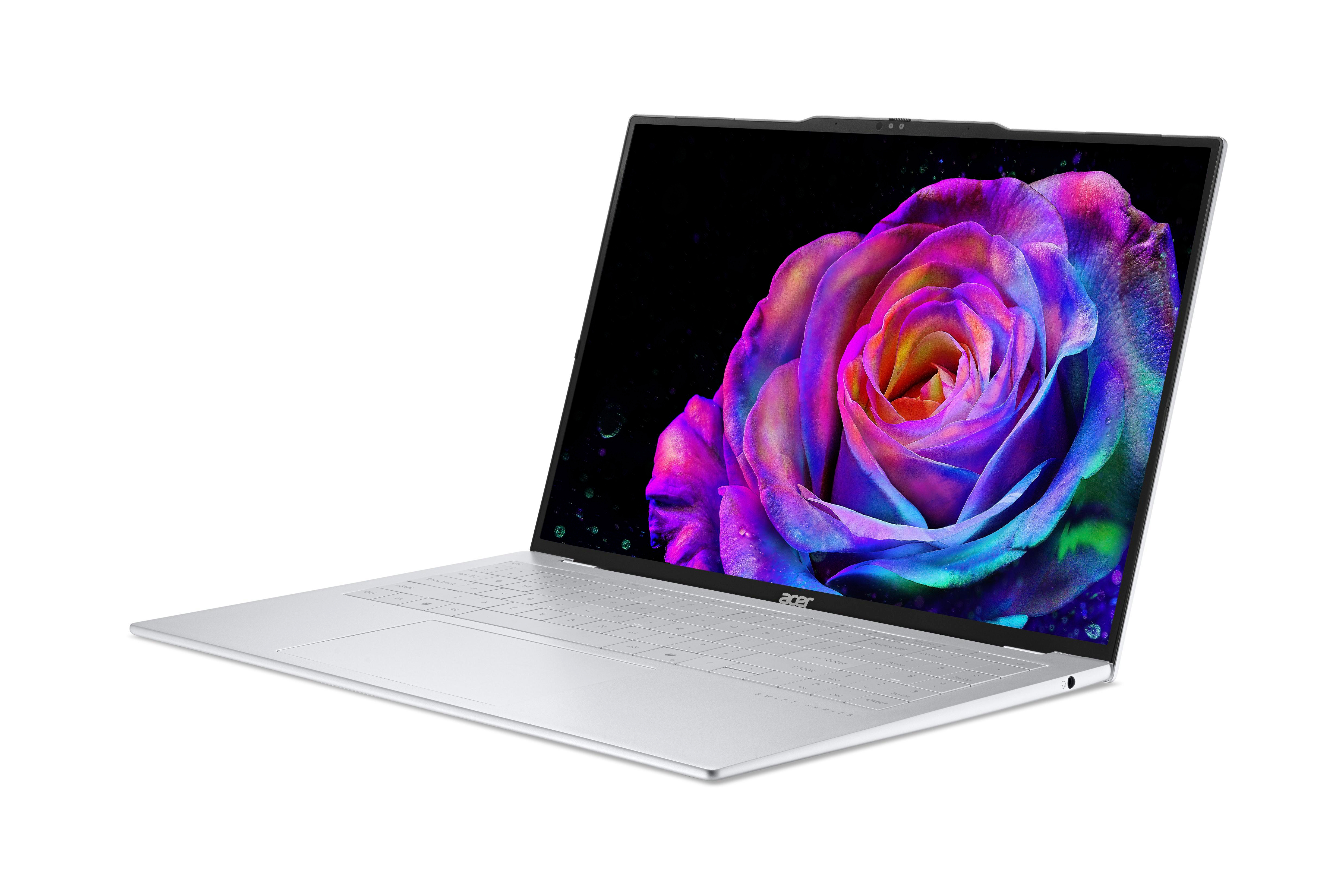 Ein silberner Laptop mit einem bunten Rosen-Hintergrundbild auf dem Bildschirm.