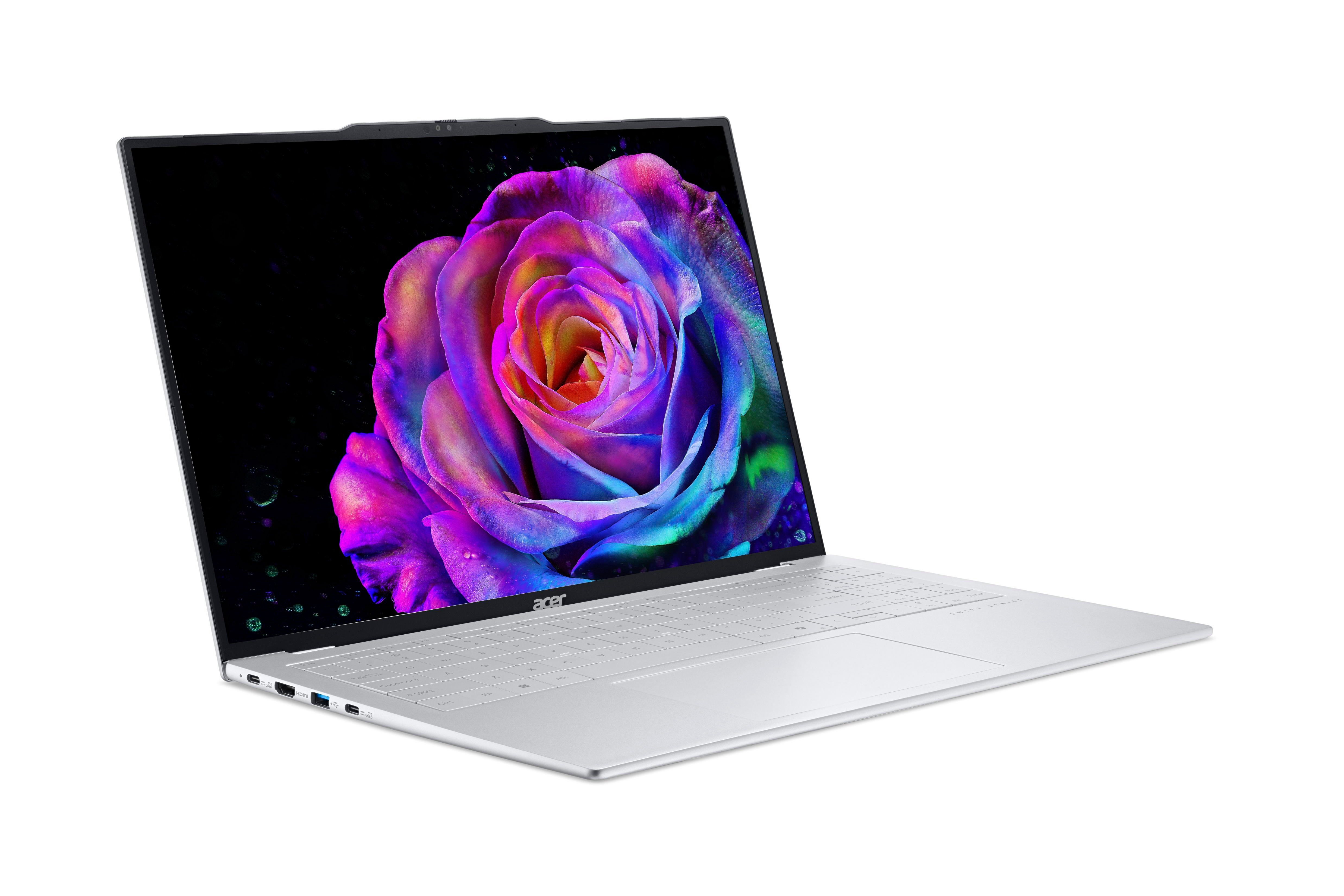 Ein geöffneter silberner Laptop mit einem bunten Rosen-Hintergrundbild.