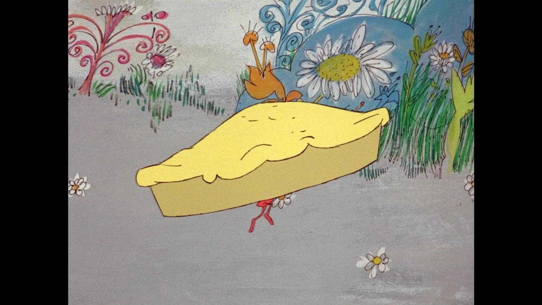 Eine gelbe Torte mit einer kleinen Figur darunter, in einer fantasievollen Landschaft.
