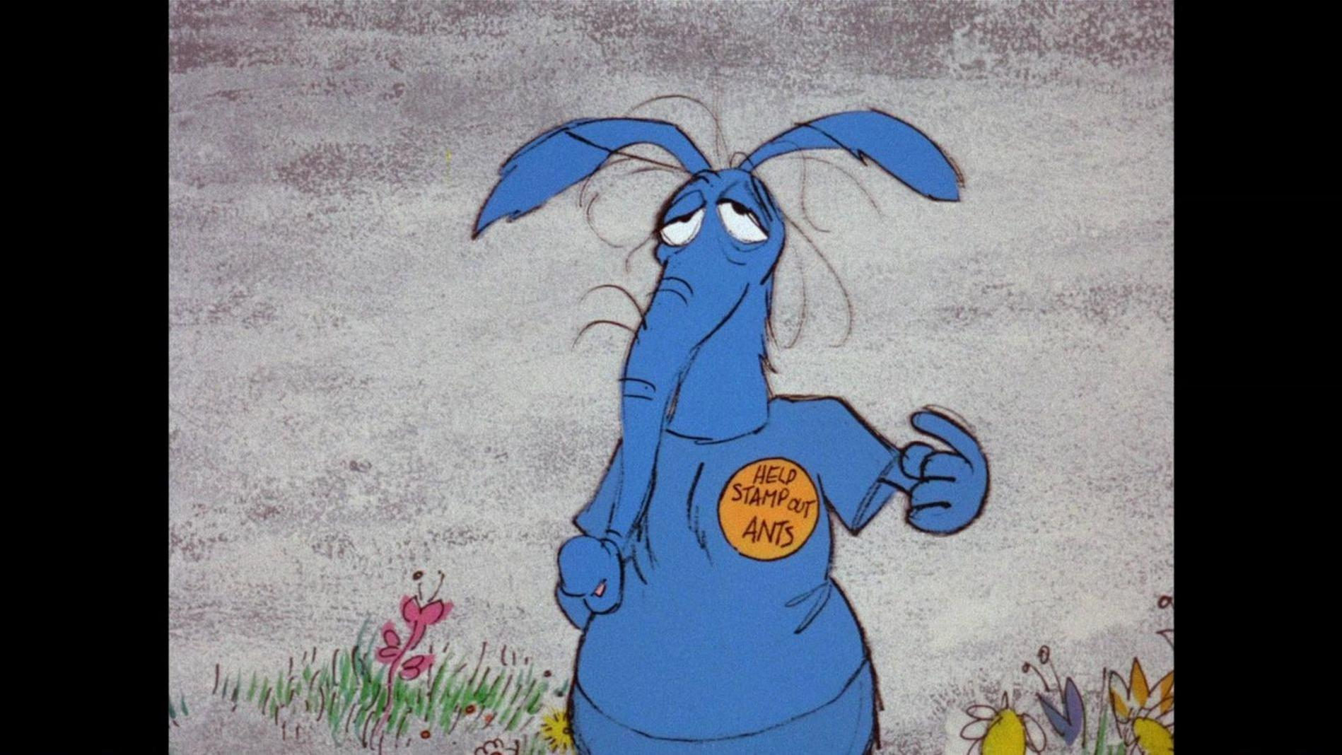 Ein blauer Ameisenbär mit einem Schild, auf dem steht: HILFE AMEN AUSROTTEN.