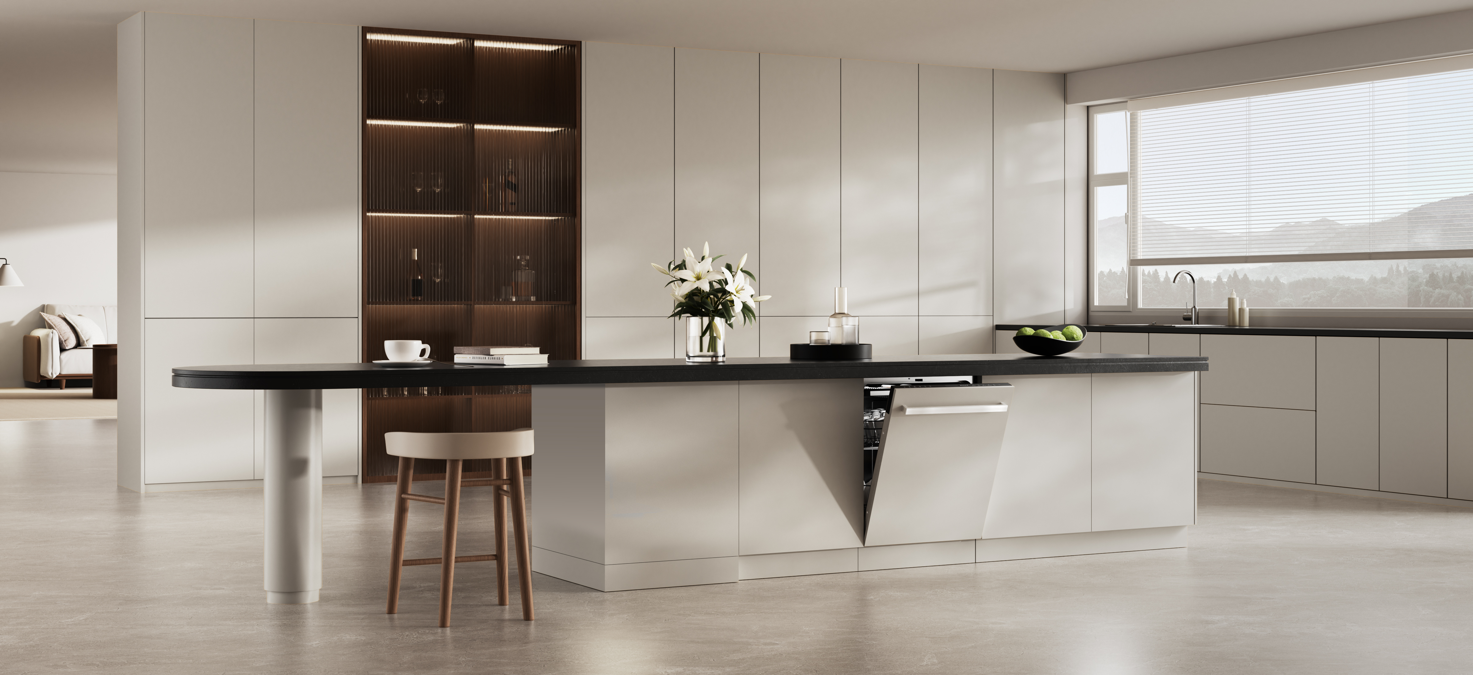 Nowoczesna kuchnia z wyspą, otwartą zmywarką, kwiatami i widokiem na góry.