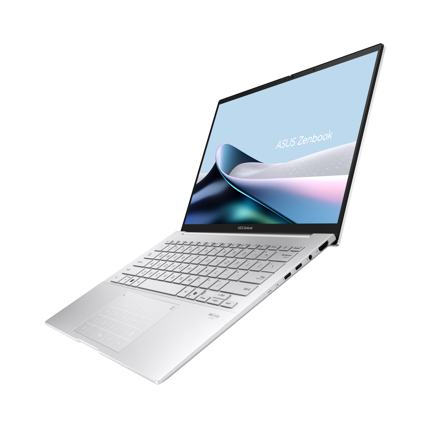 Un portátil Asus Zenbook plateado con teclado retroiluminado y teclado numérico.