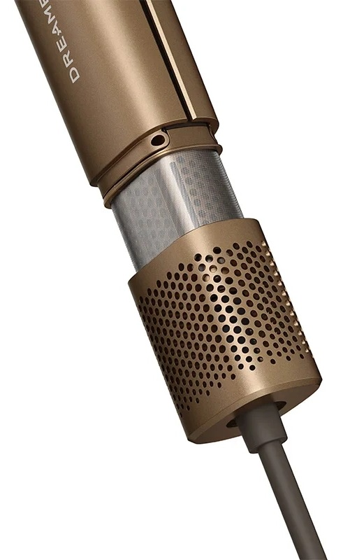 Złota końcówka suszarki do włosów z perforowaną obudową i kablem.