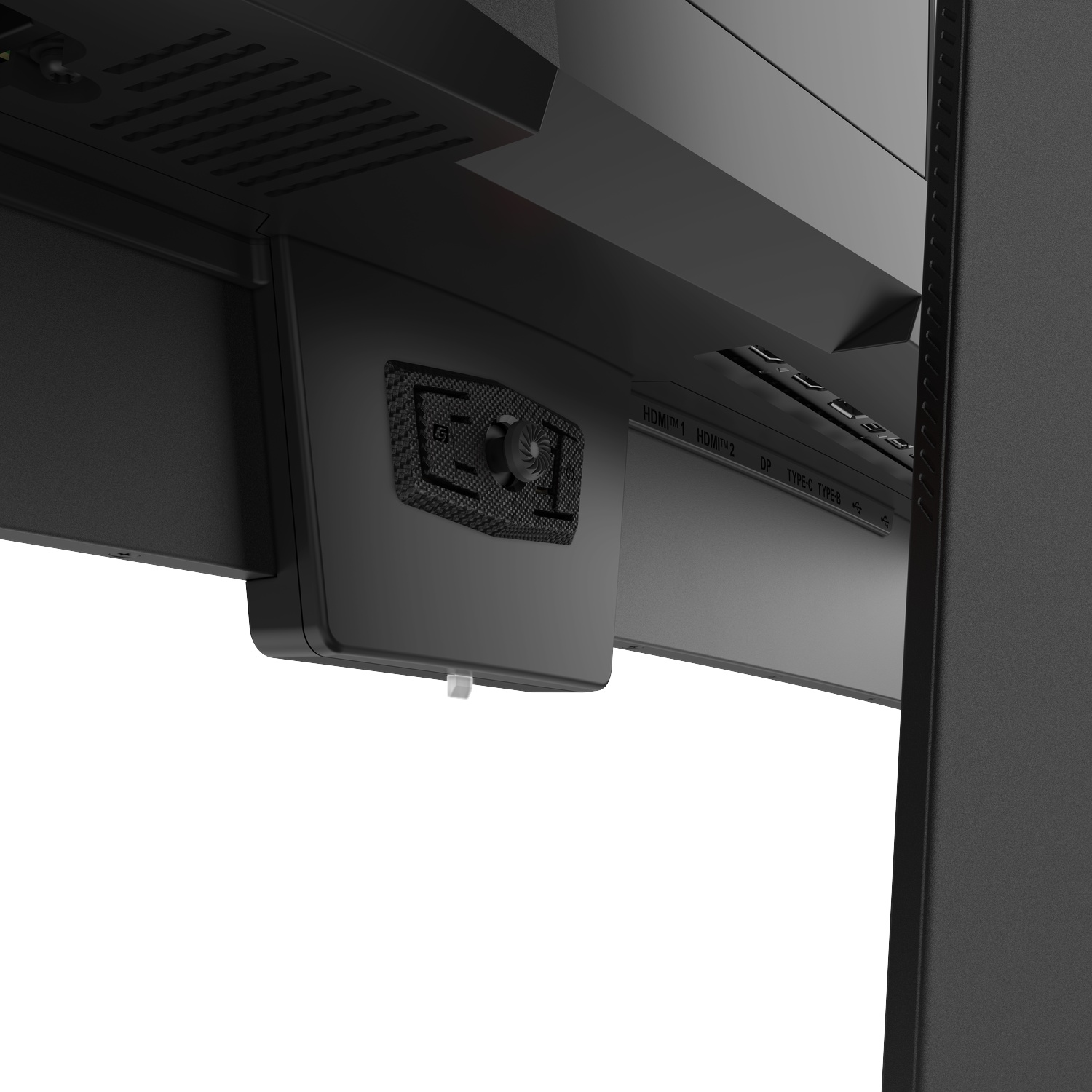 Gros plan du dessous d'un moniteur noir, montrant les ports.