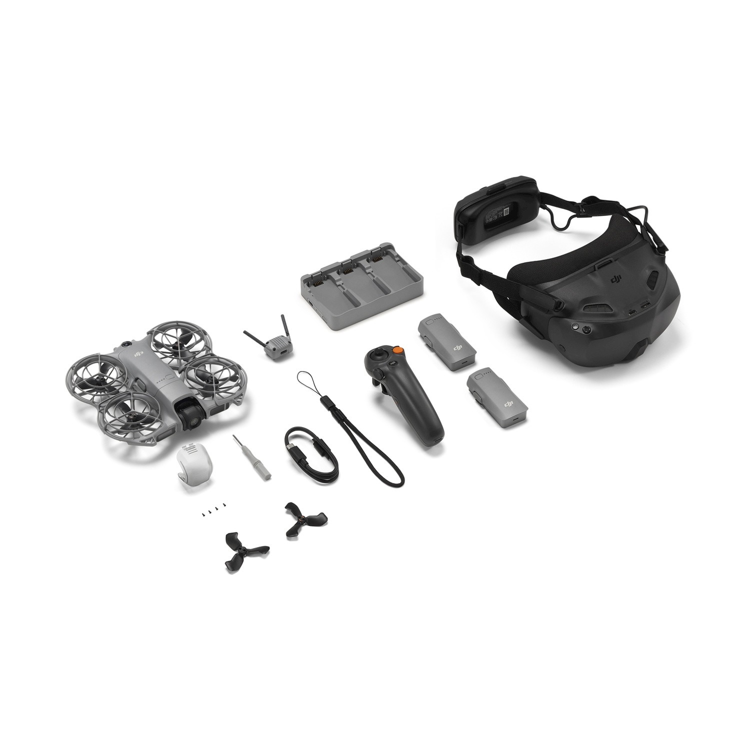 Kit mini drone grigio con occhiali, controller, batterie, stazione di ricarica ed eliche.