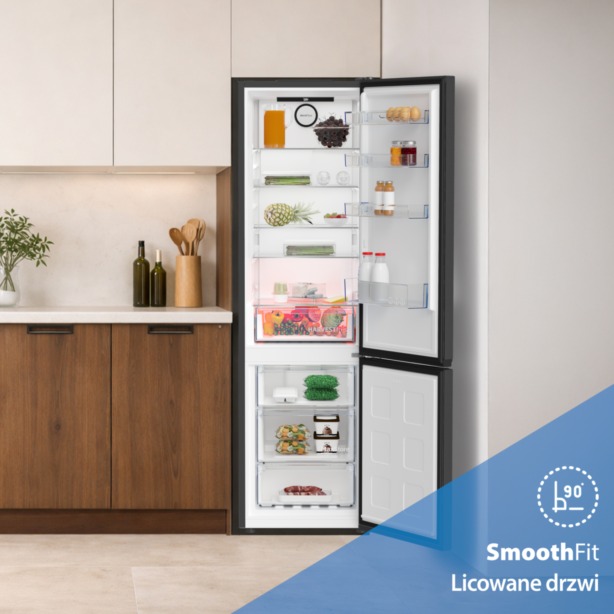 Otwarta lodówka z jedzeniem i szufladą na owoce i warzywa.