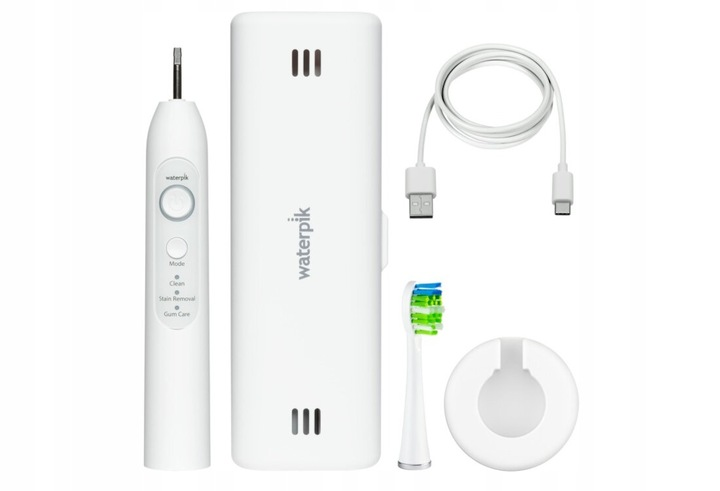 Biała szczoteczka elektryczna, etui ładujące i kabel.