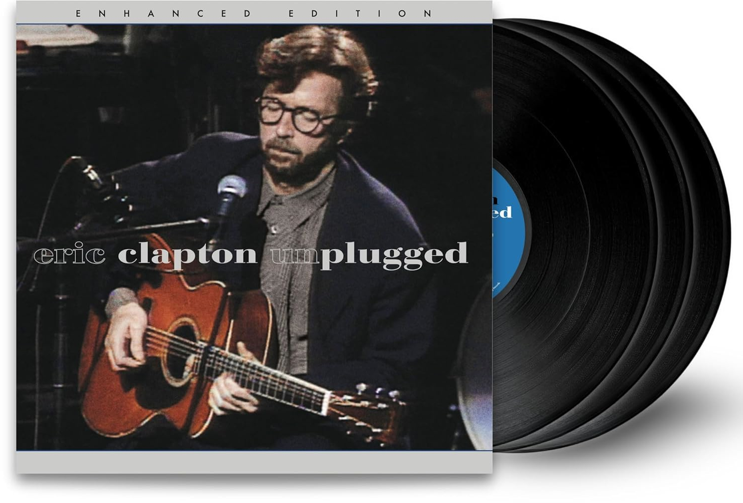 Eric Clapton gitározik egy albumon, mellette bakelit lemezek.