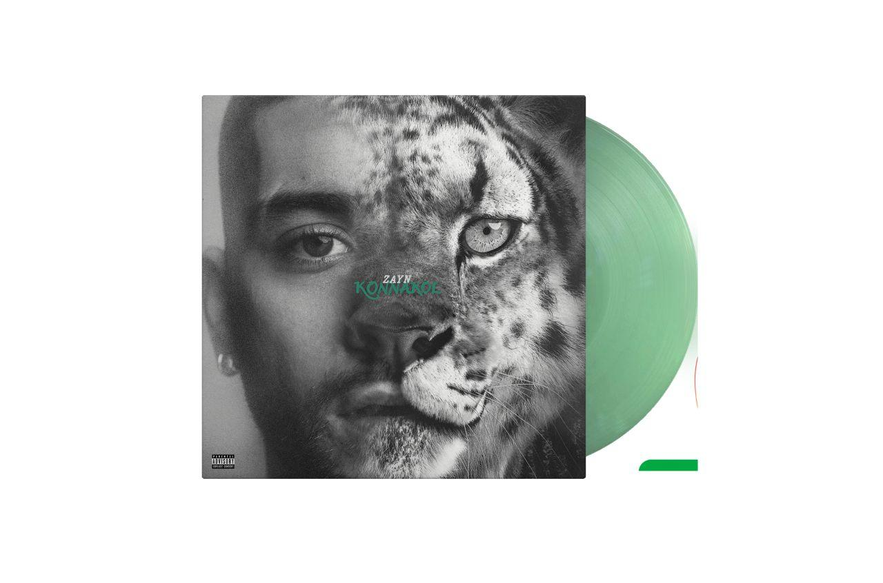 Albumcover: Gesicht eines Mannes verschmilzt mit einem Leoparden. Grüne Schallplatte.