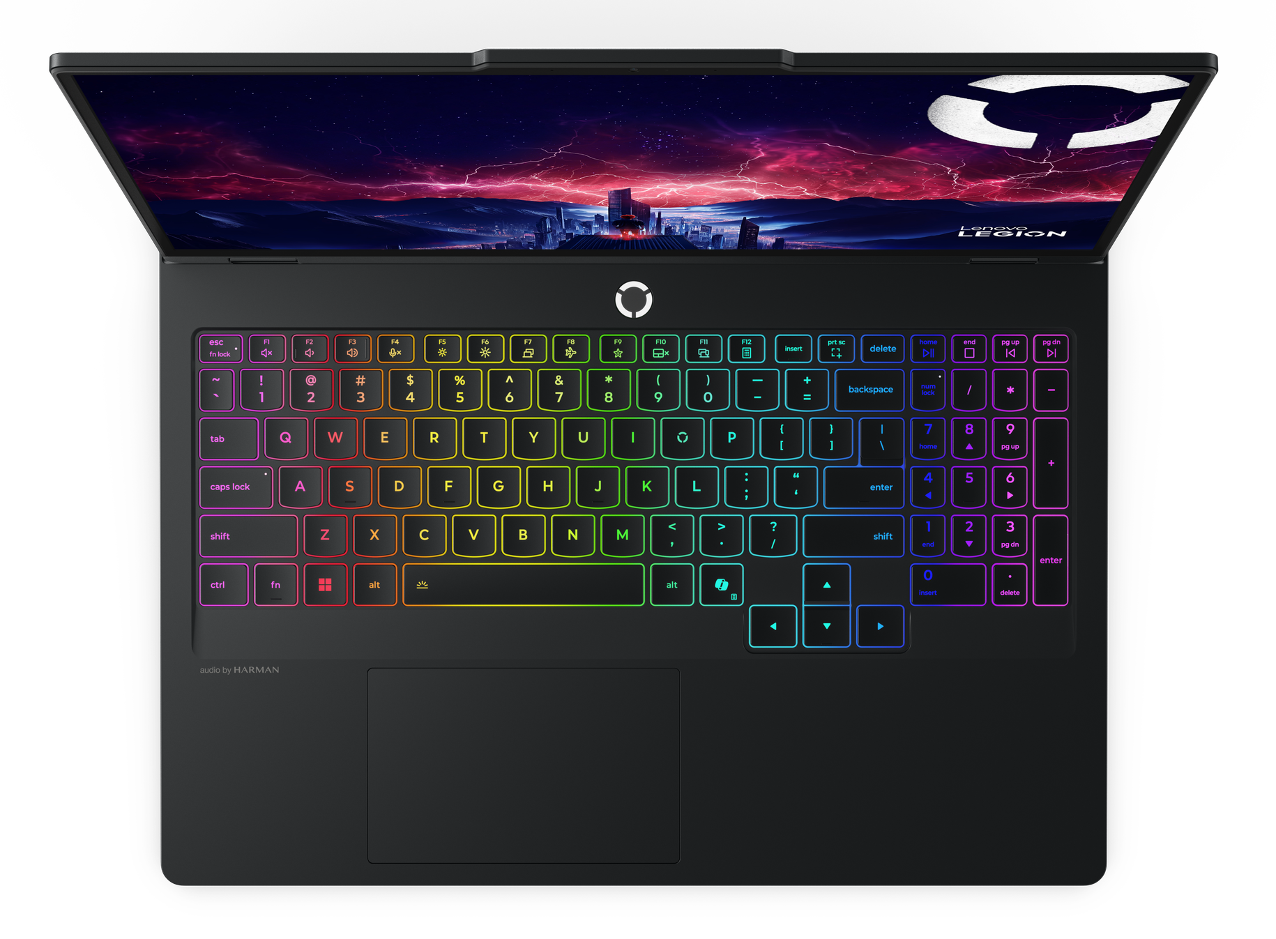 Otwarty laptop z podświetlaną klawiaturą i burzliwą tapetą miasta.