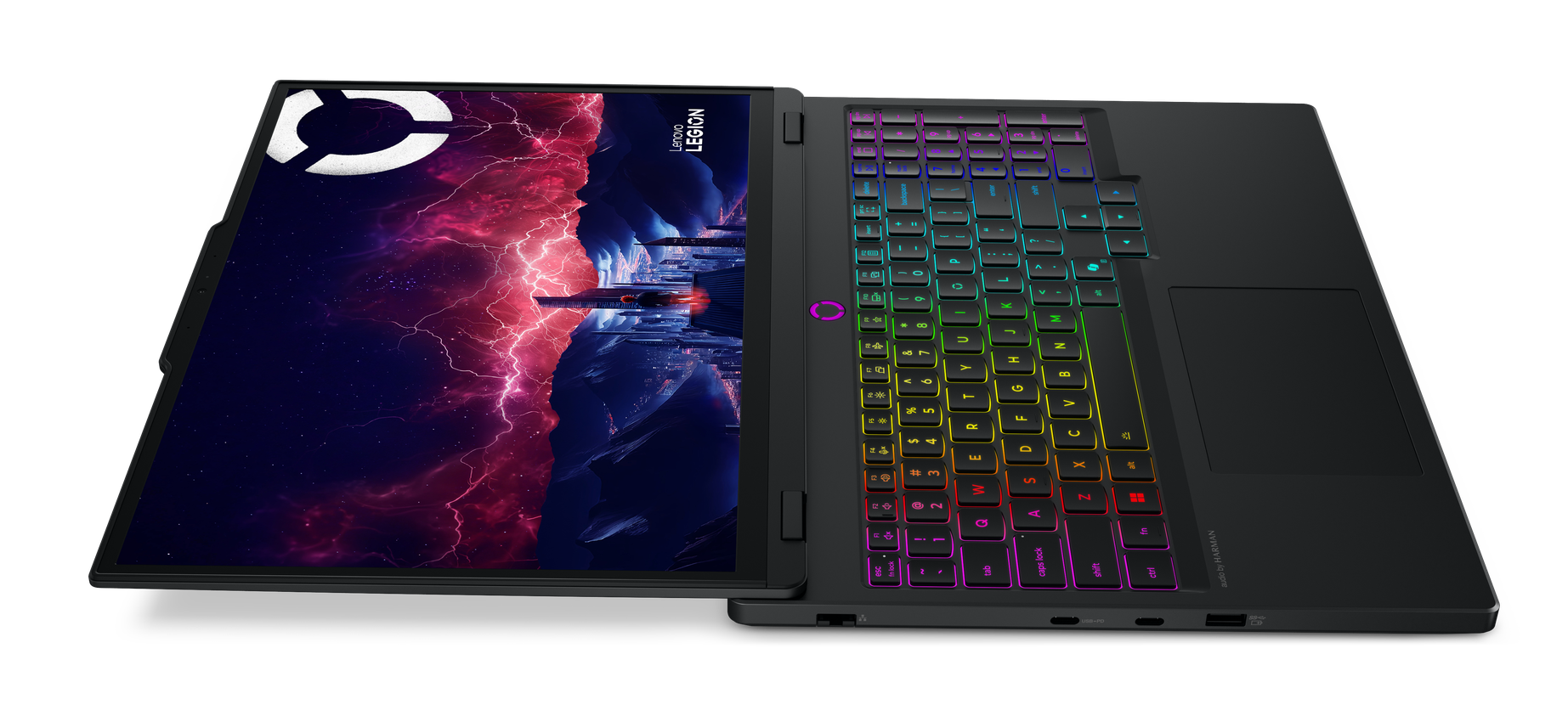 Czarny laptop z podświetlaną klawiaturą i kosmiczną tapetą.