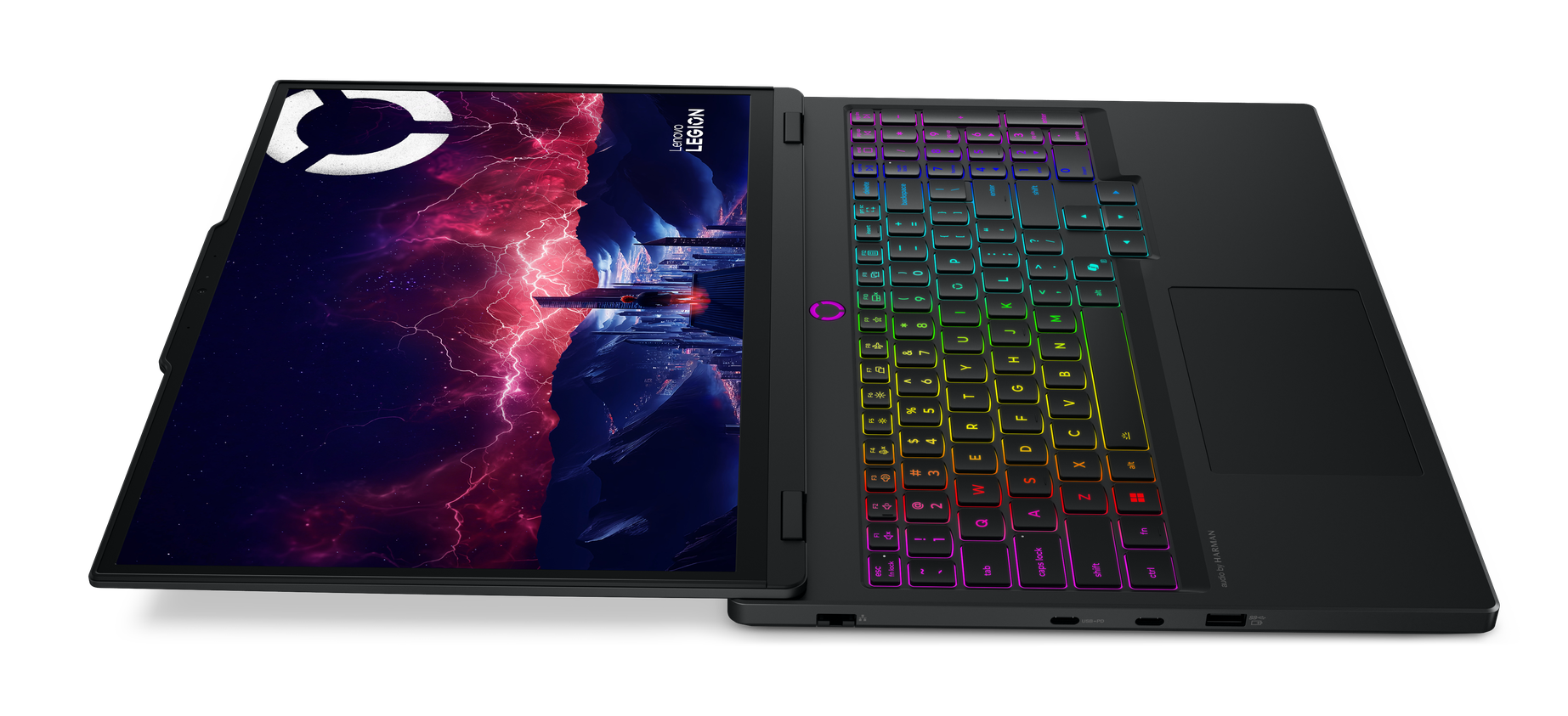 Otwarty czarny laptop Lenovo Legion z kolorowym podświetleniem klawiatury i kosmiczną tapetą.