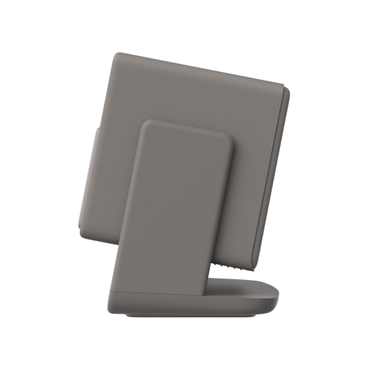 Szary tablet spoczywa na stojaku, widziany z boku.