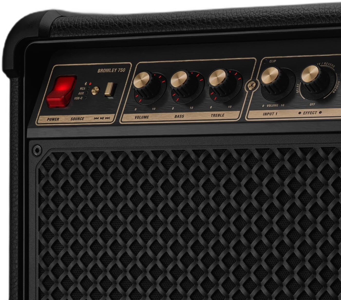 Zbliżenie czarnego wzmacniacza ze złotymi gałkami i czerwonymi przełącznikami.