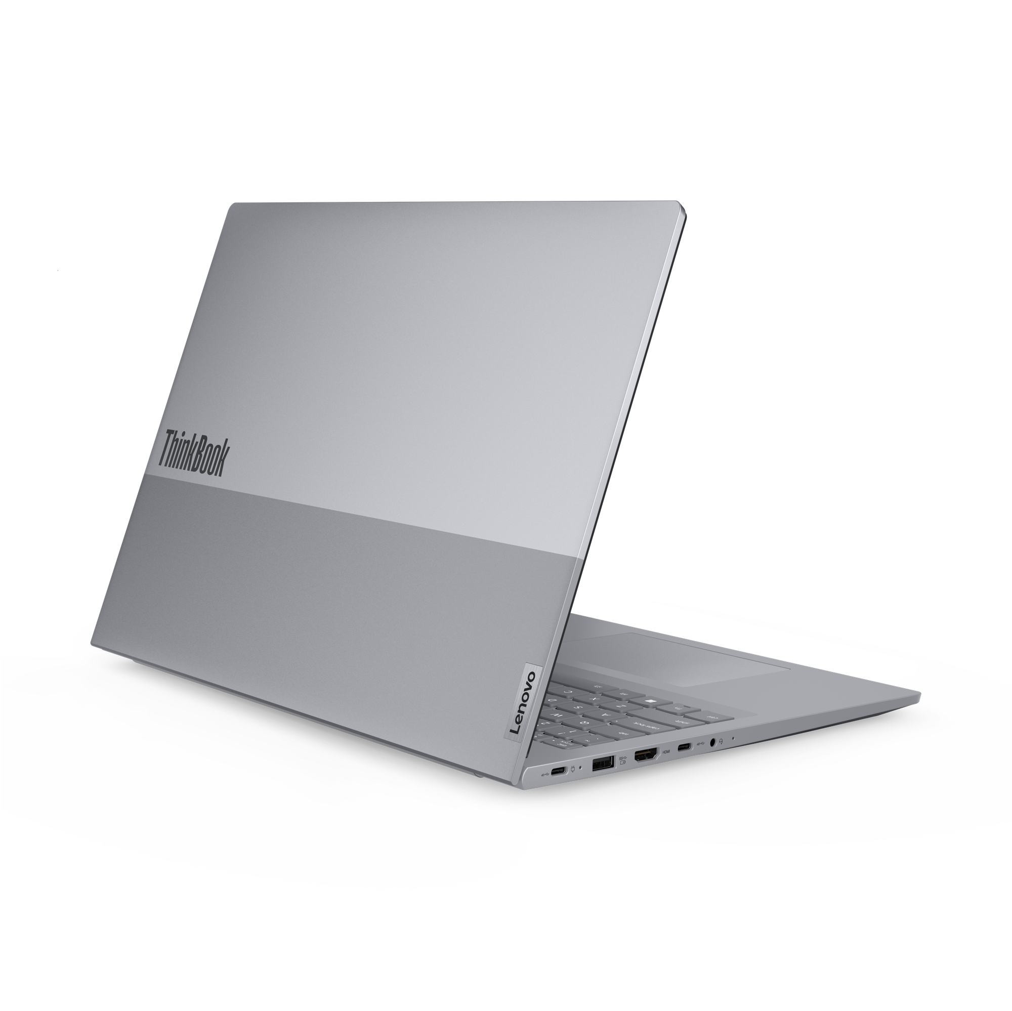 Ein silberner Laptop mit ThinkBook-Logo, von der Seite gezeigt. Tastatur und Anschlüsse sind sichtbar.