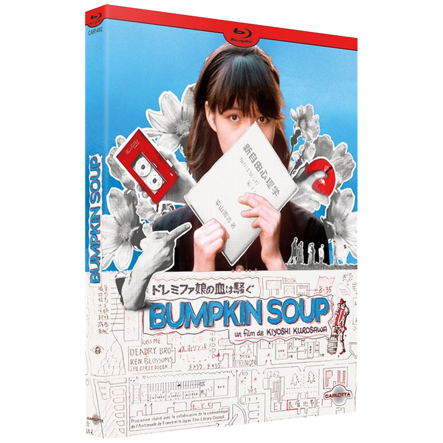 Een vrouw houdt een boek vast met de titel 'BUMPKIN SOUP'. Bloemen en een cassette zijn afgebeeld.