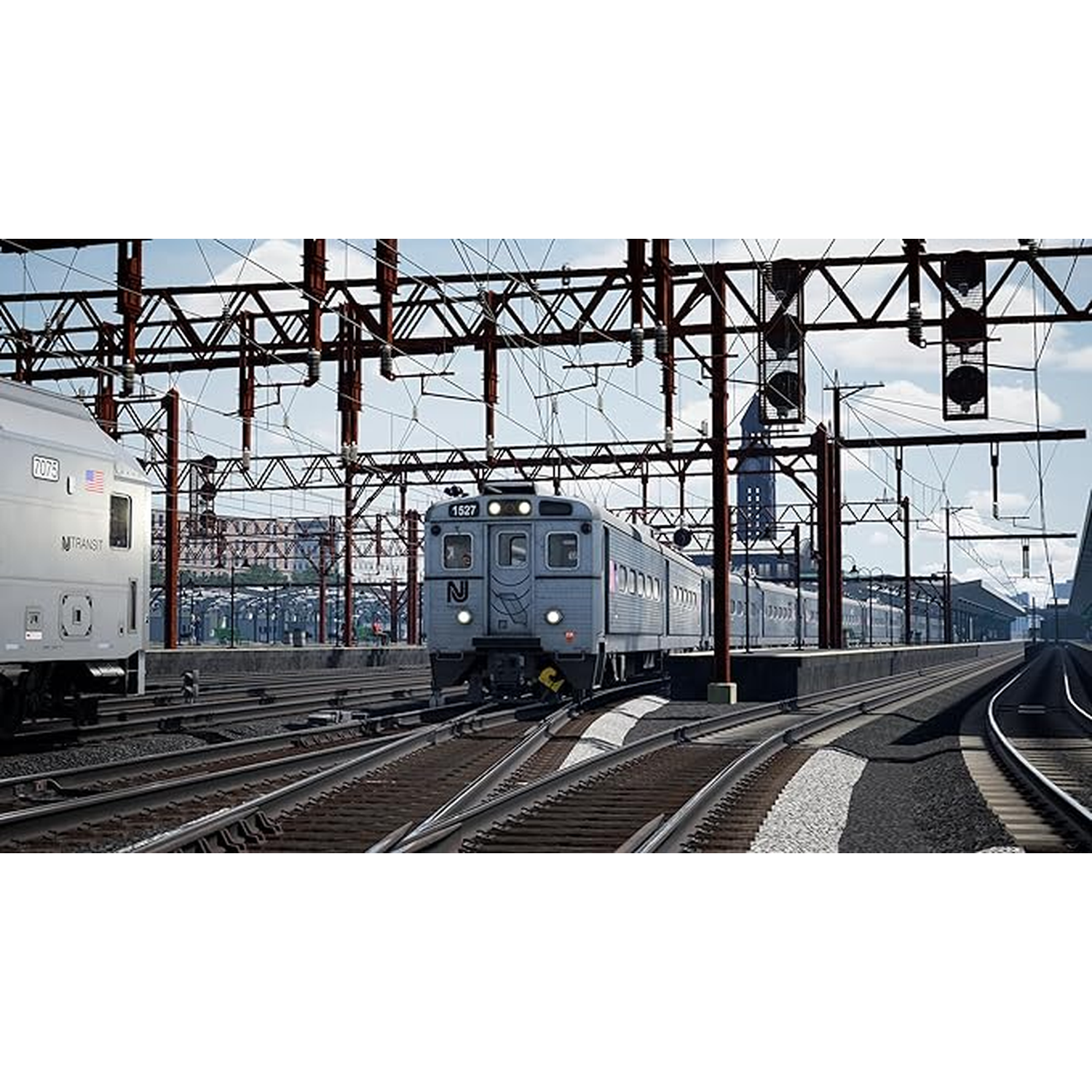 Twee treinen op spoorrails met bovenleidingen en seinen.