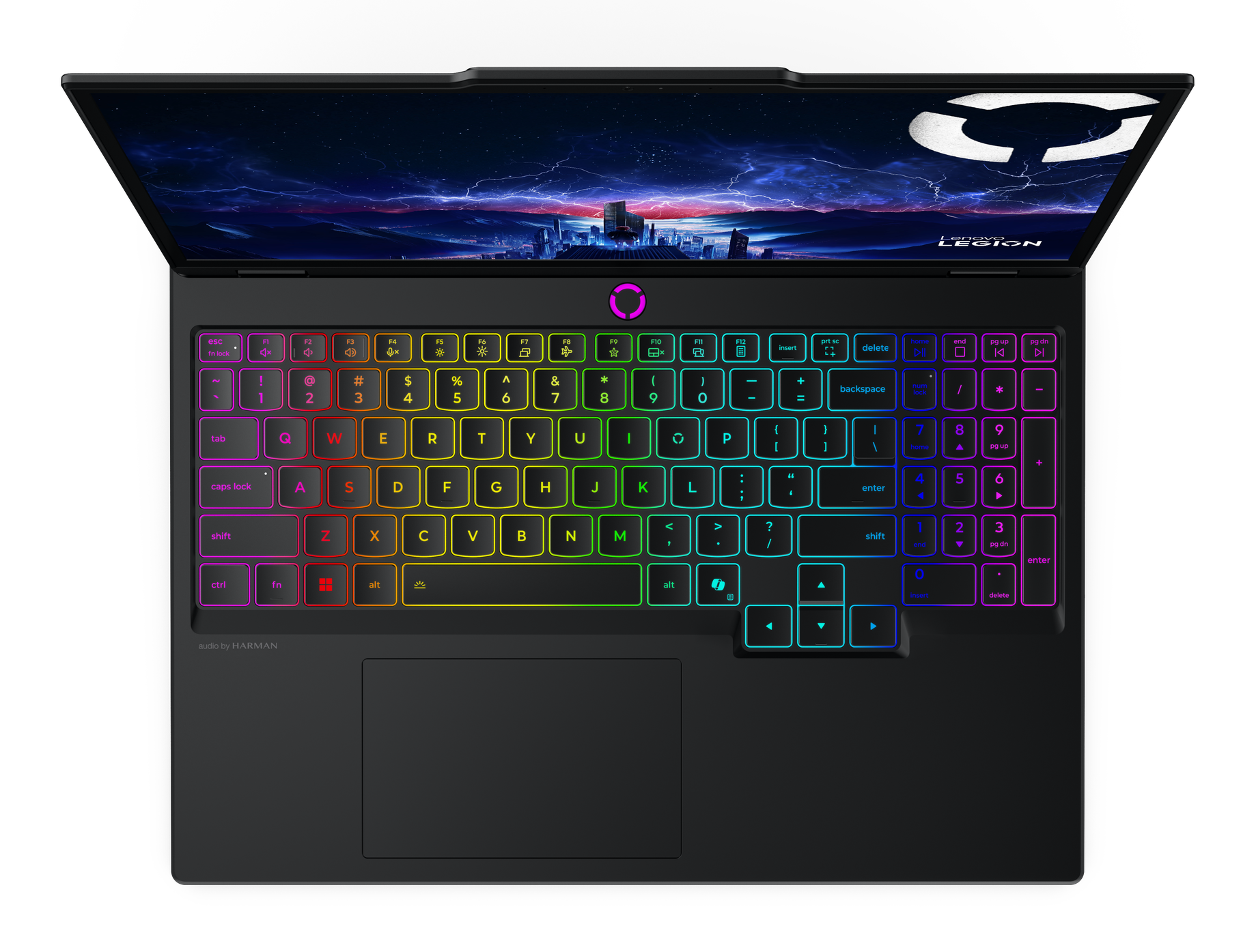 Otwarty laptop z podświetlaną klawiaturą i tapetą z panoramą miasta.