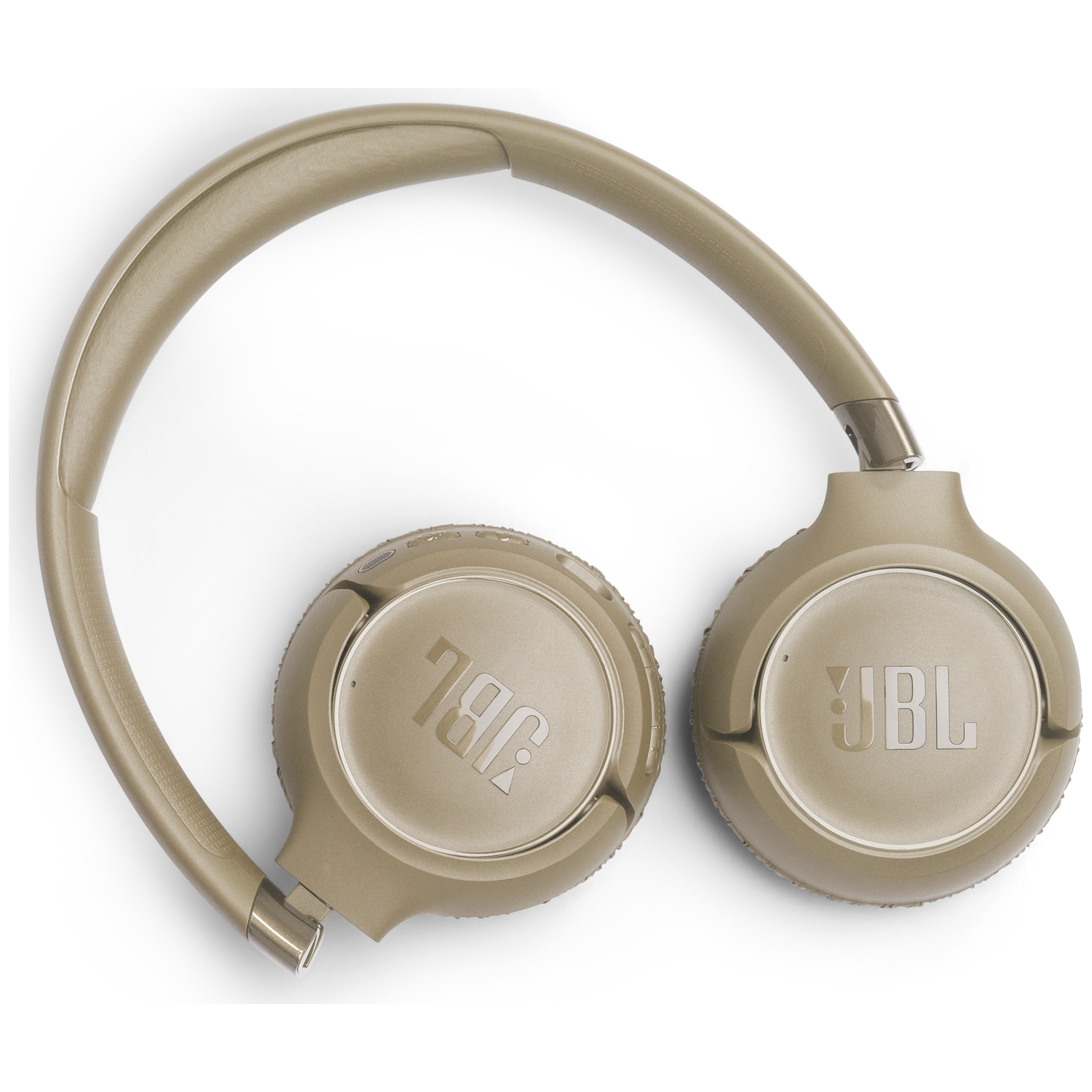 Beige JBL koptelefoon liggend op witte achtergrond.