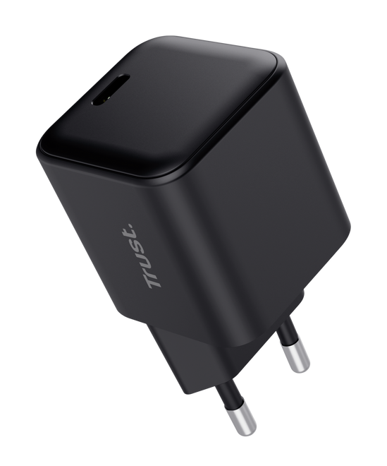 Czarna ładowarka sieciowa Trust z dwoma metalowymi bolcami.