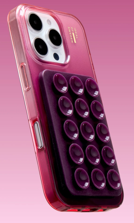 Ein pinkes iPhone-Case mit einem lila Halter, der 12 Saugnäpfe hat.